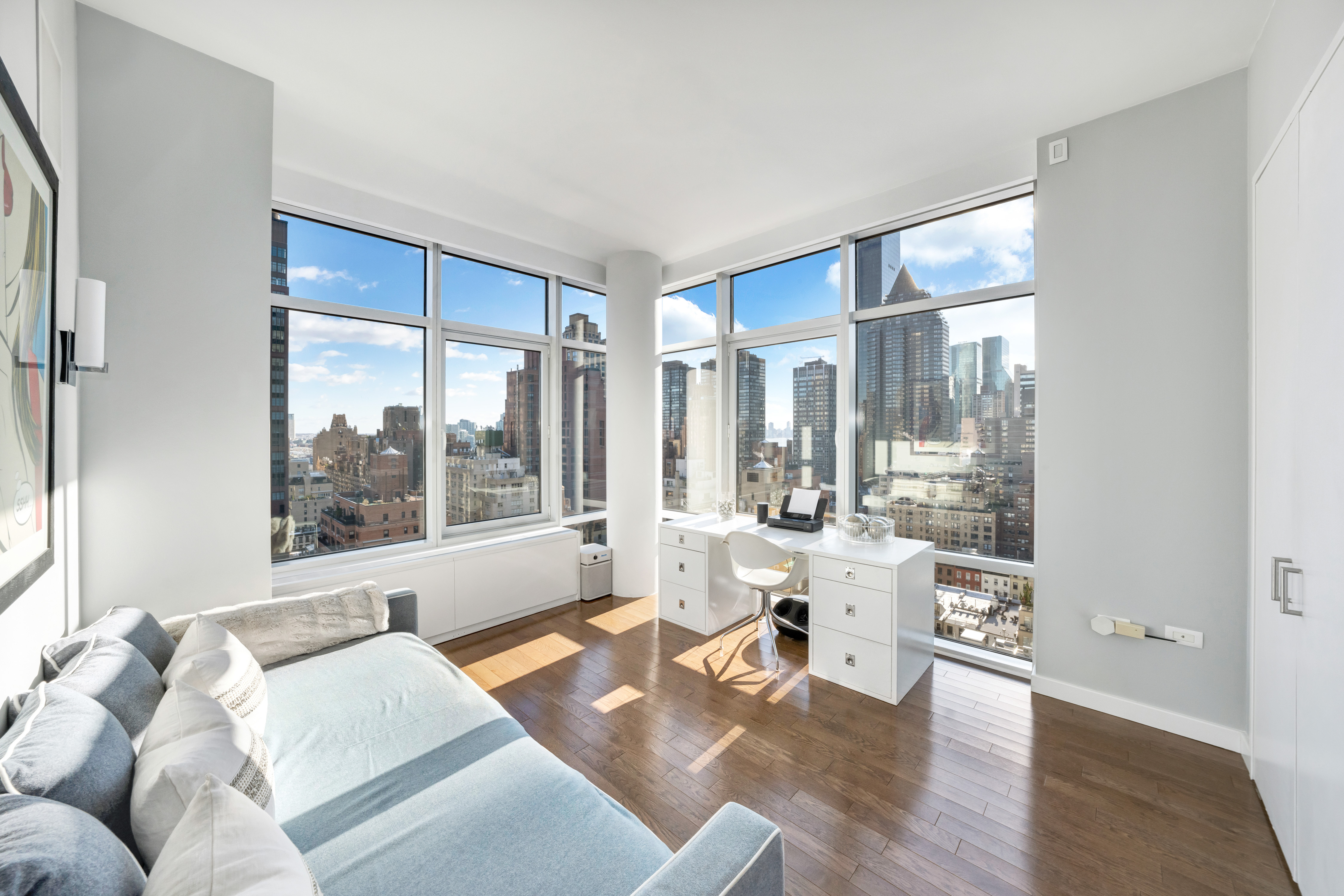 310 East 53rd Street, Unit 18A Manhattan, NY 10022 - Photo 14 of 19 a living room with furniture and a large window