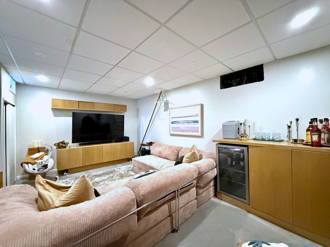 269 Ainslie Street Brooklyn, NY 11211 - Photo 11 of 22 a bedroom with furniture and a flat screen tv