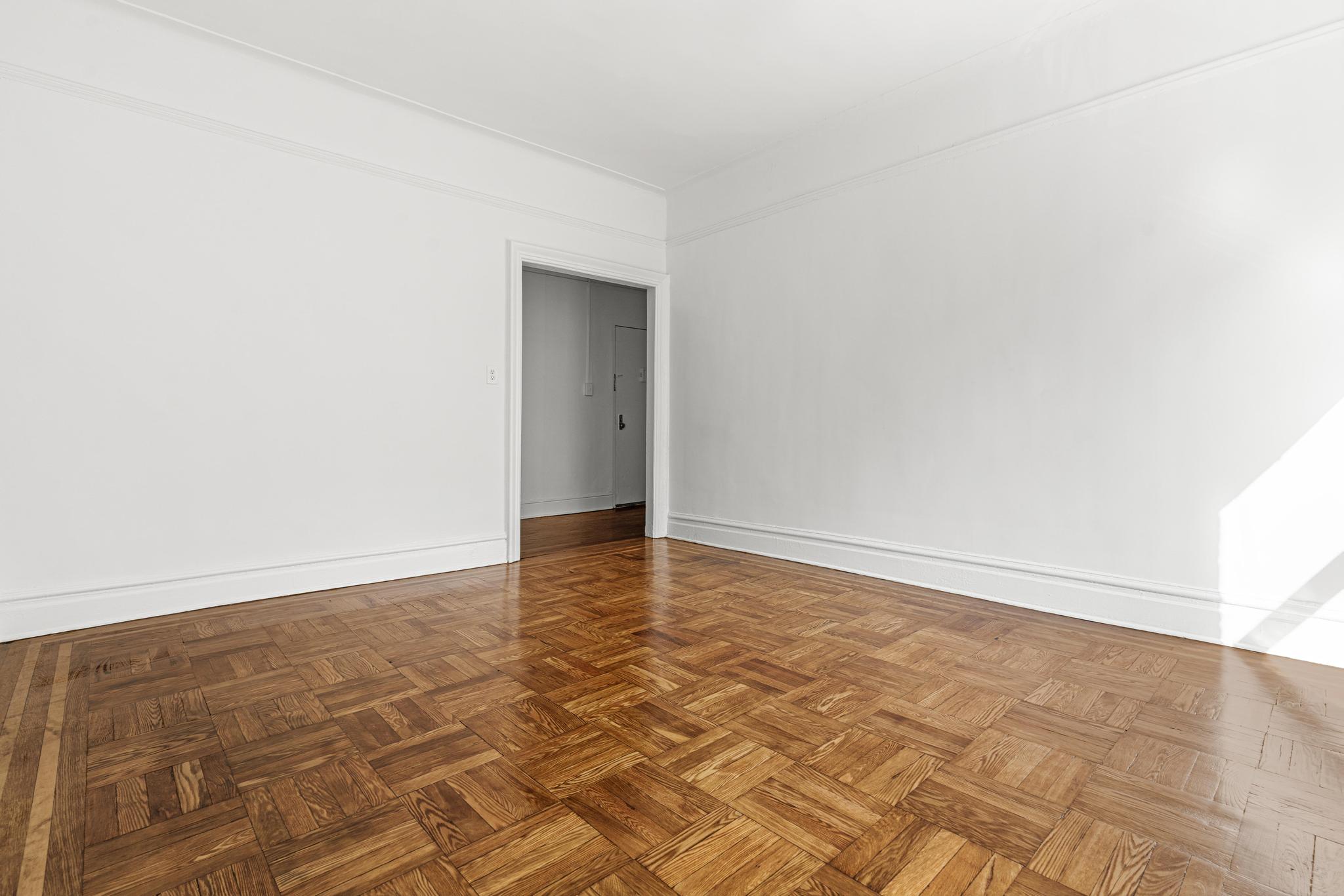 1001 President Street, Unit L2 Brooklyn, NY 11225 - Photo 5 of 19 a view of an empty room and wooden floor
