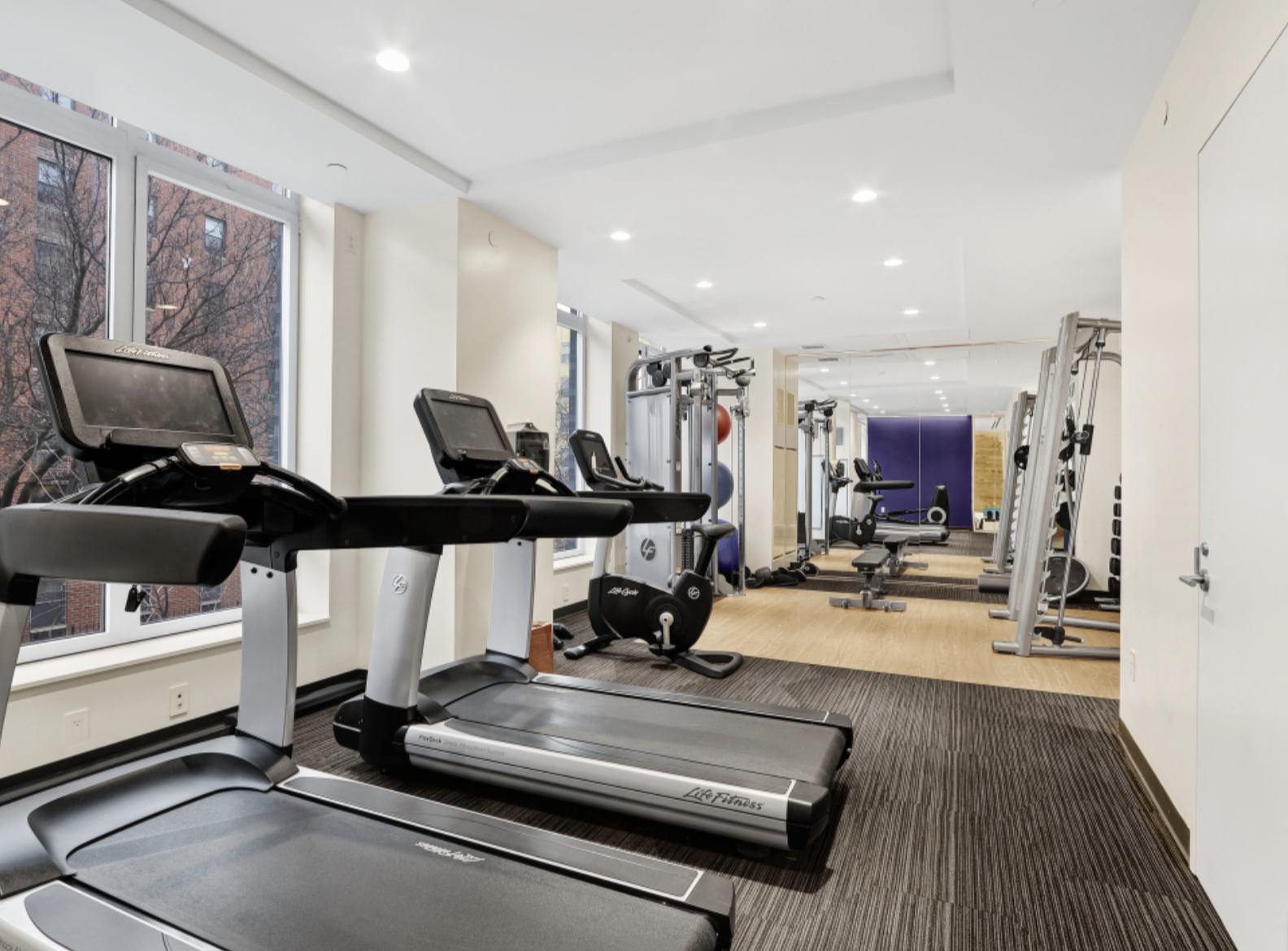 285 West 110th Street, Unit 9B Manhattan, NY 10026 - Photo 14 of 20 a view of a room with gym equipment