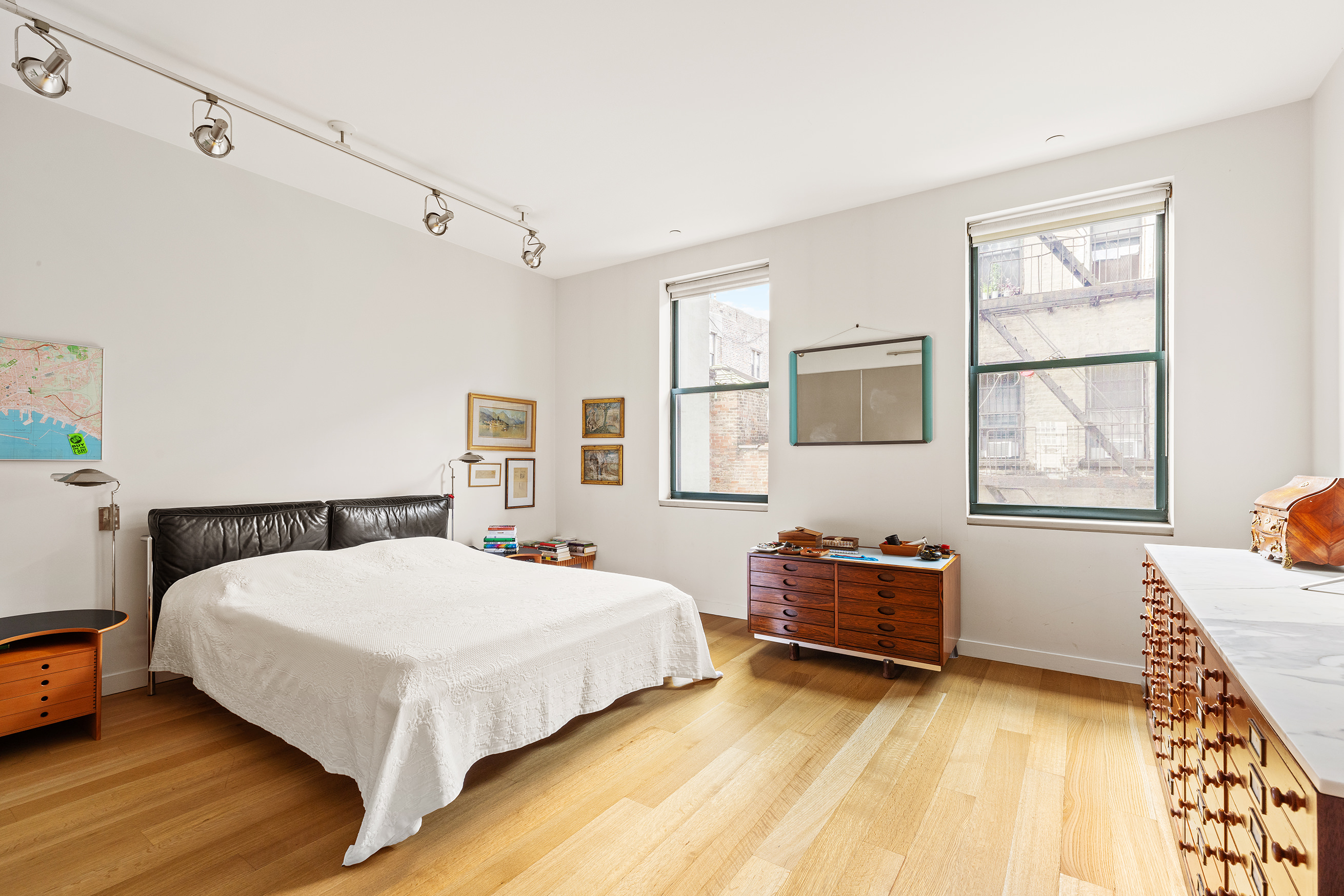 71 Ludlow Street, Unit 4B Manhattan, NY 10002 - Photo 8 of 15 a bedroom with a bed and a window