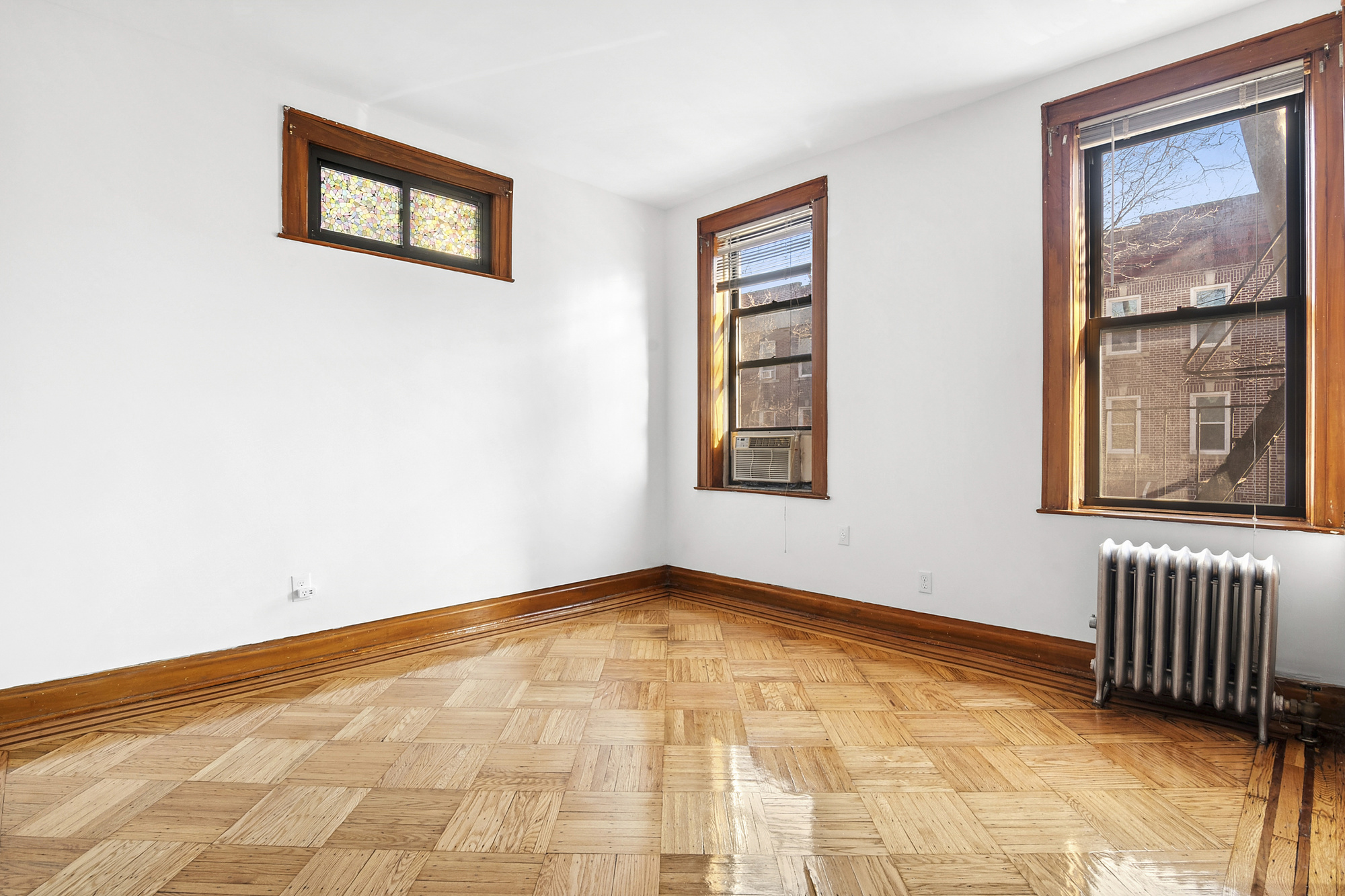 275 Schaefer Street, Unit 2F Brooklyn, NY 11237 - Photo 1 of 4 a view of an empty room with a window