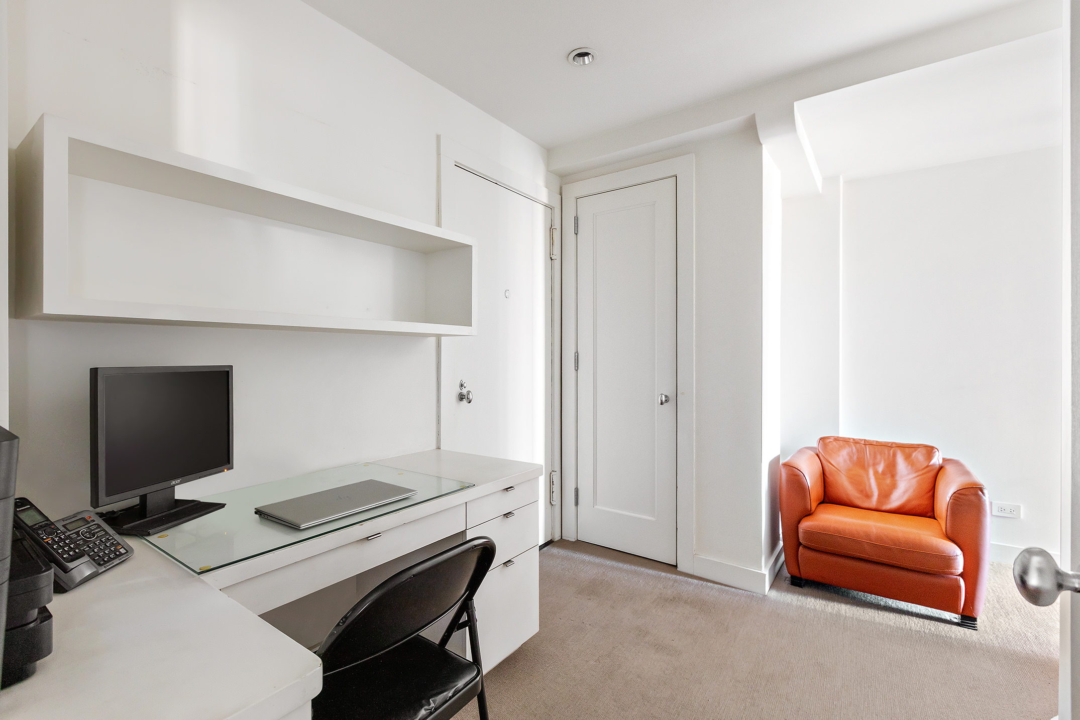 45 East End Avenue, Unit 6/7B Manhattan, NY 10028 - Photo 12 of 17 a room with furniture and a flat screen tv