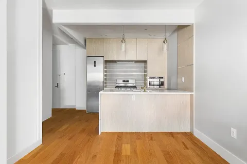 a kitchen with wooden floor