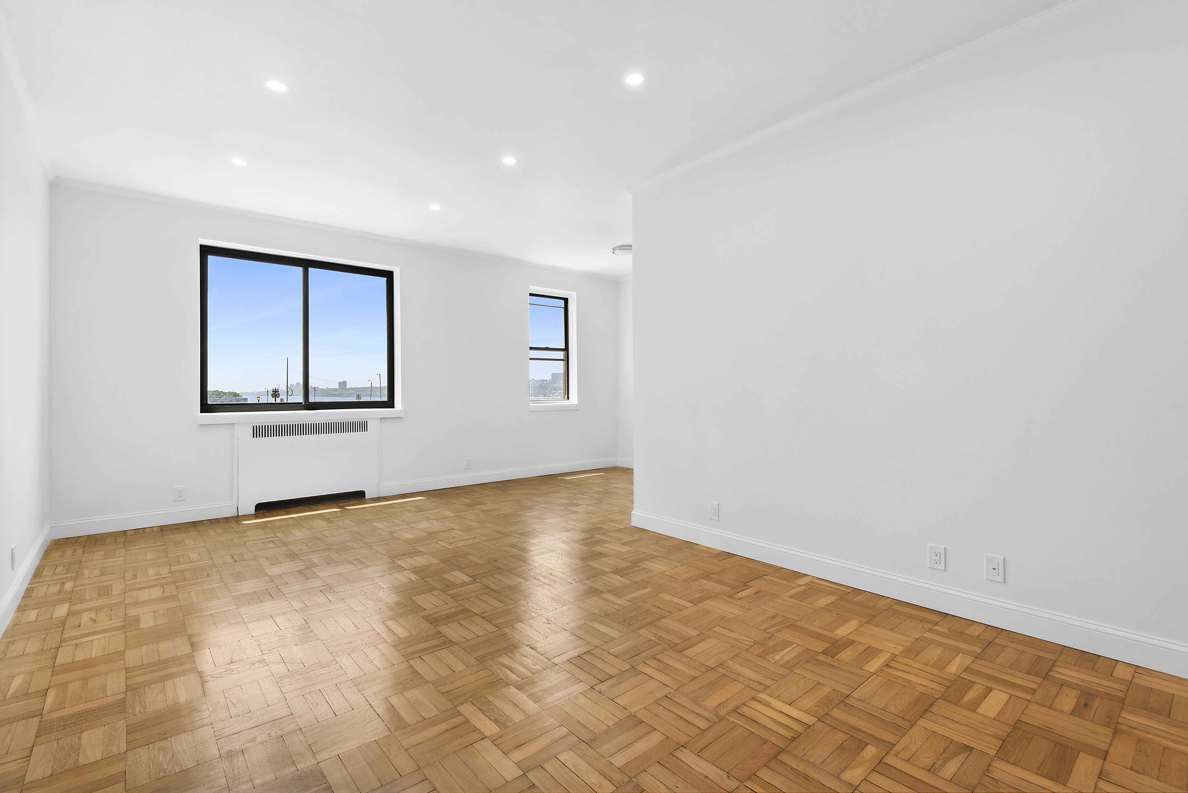 159-00 Riverside Drive West, Unit 2C-50 Manhattan, NY 10032 - Photo 2 of 20 a view of an empty room with a window