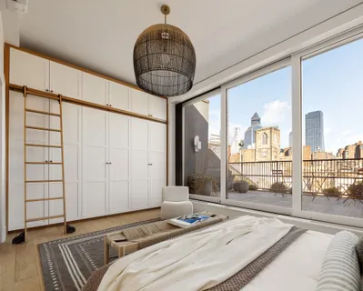 a bedroom with double bed and a window