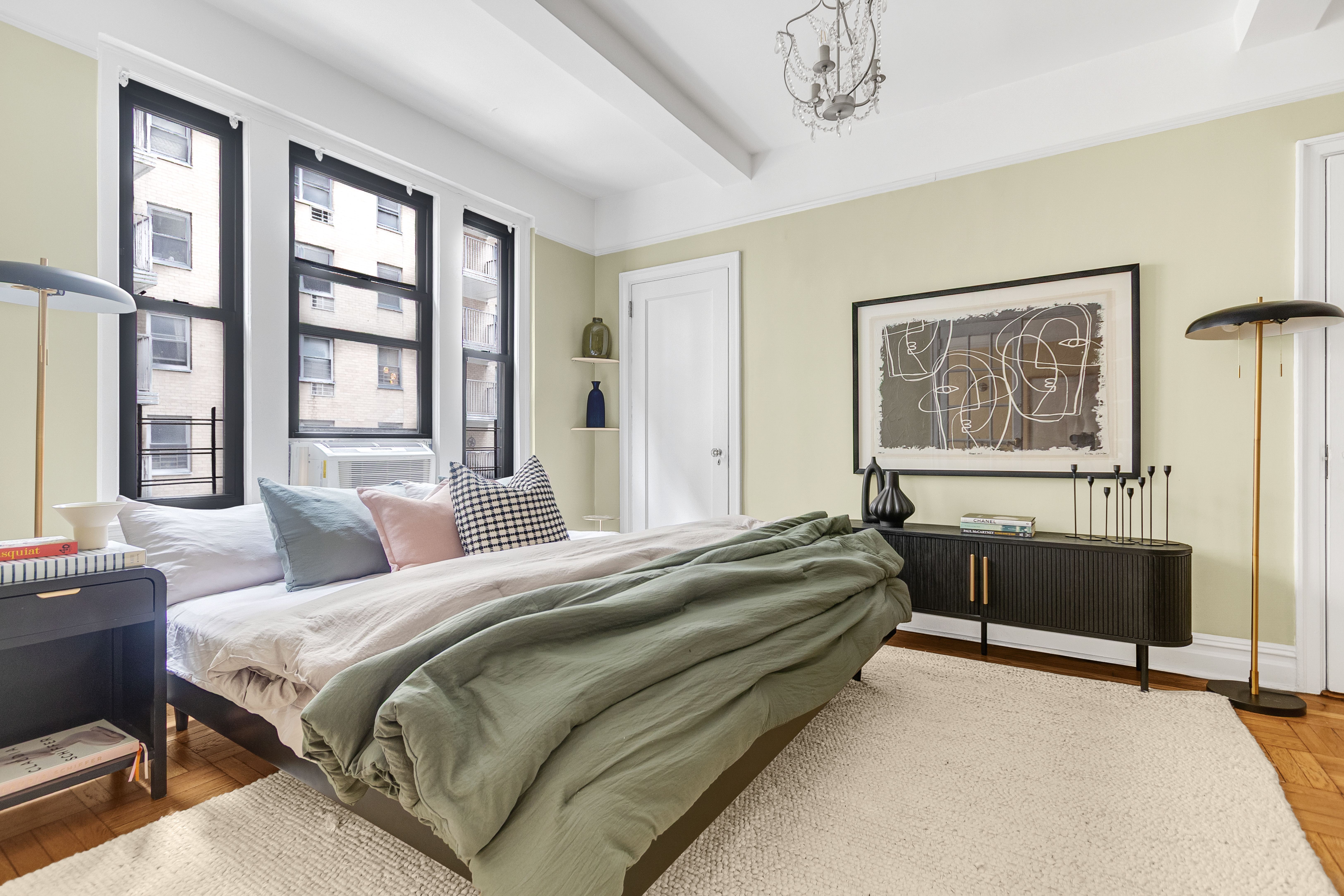41 West 96th Street, Unit 4C Manhattan, NY 10025 - Photo 9 of 14 a spacious bedroom with a bed and a large window