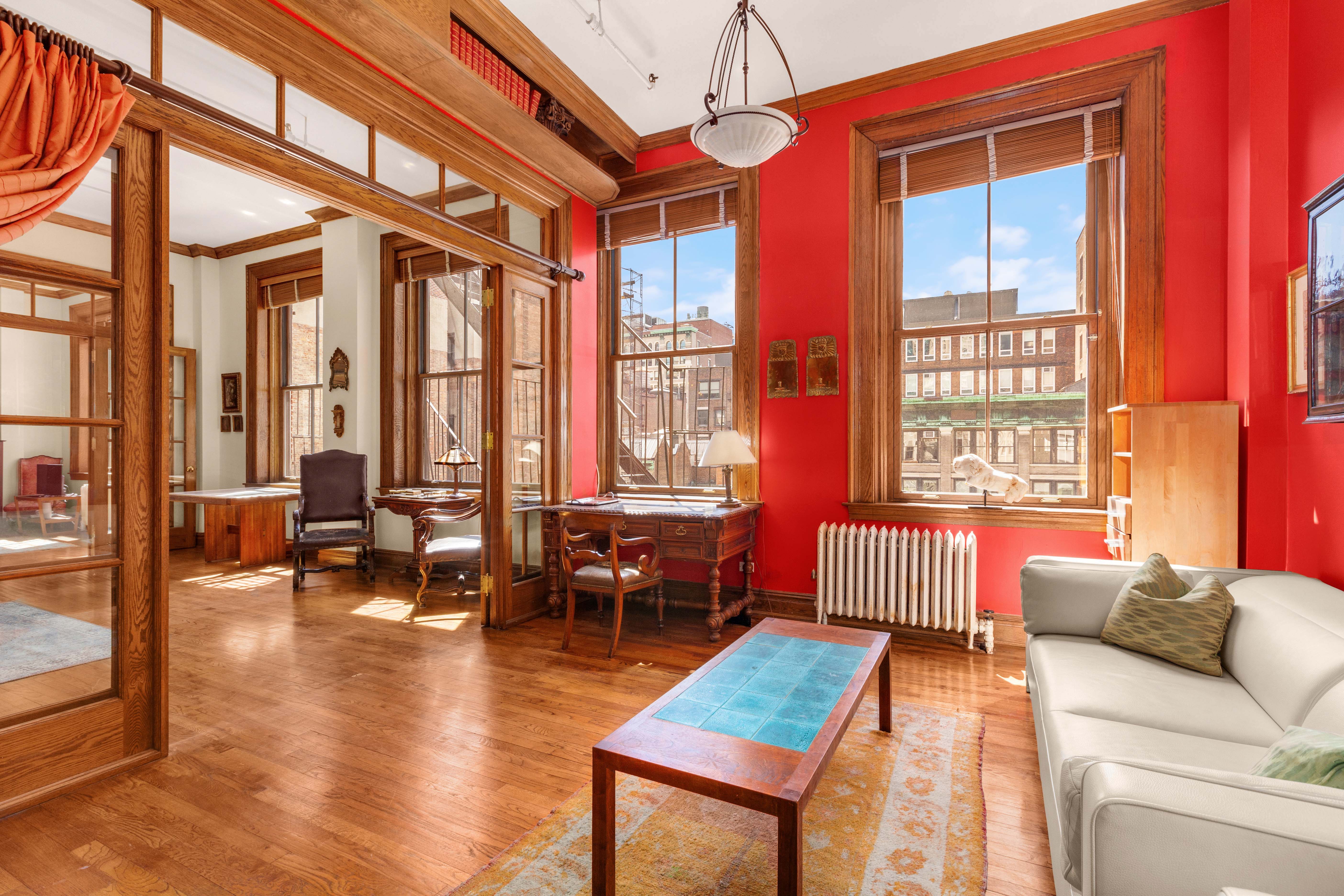 30 East 21st Street, Unit 6B Manhattan, NY 10010 - Photo 7 of 16 a living room with furniture and floor to ceiling windows