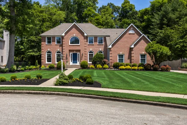 a front view of a house with a yard