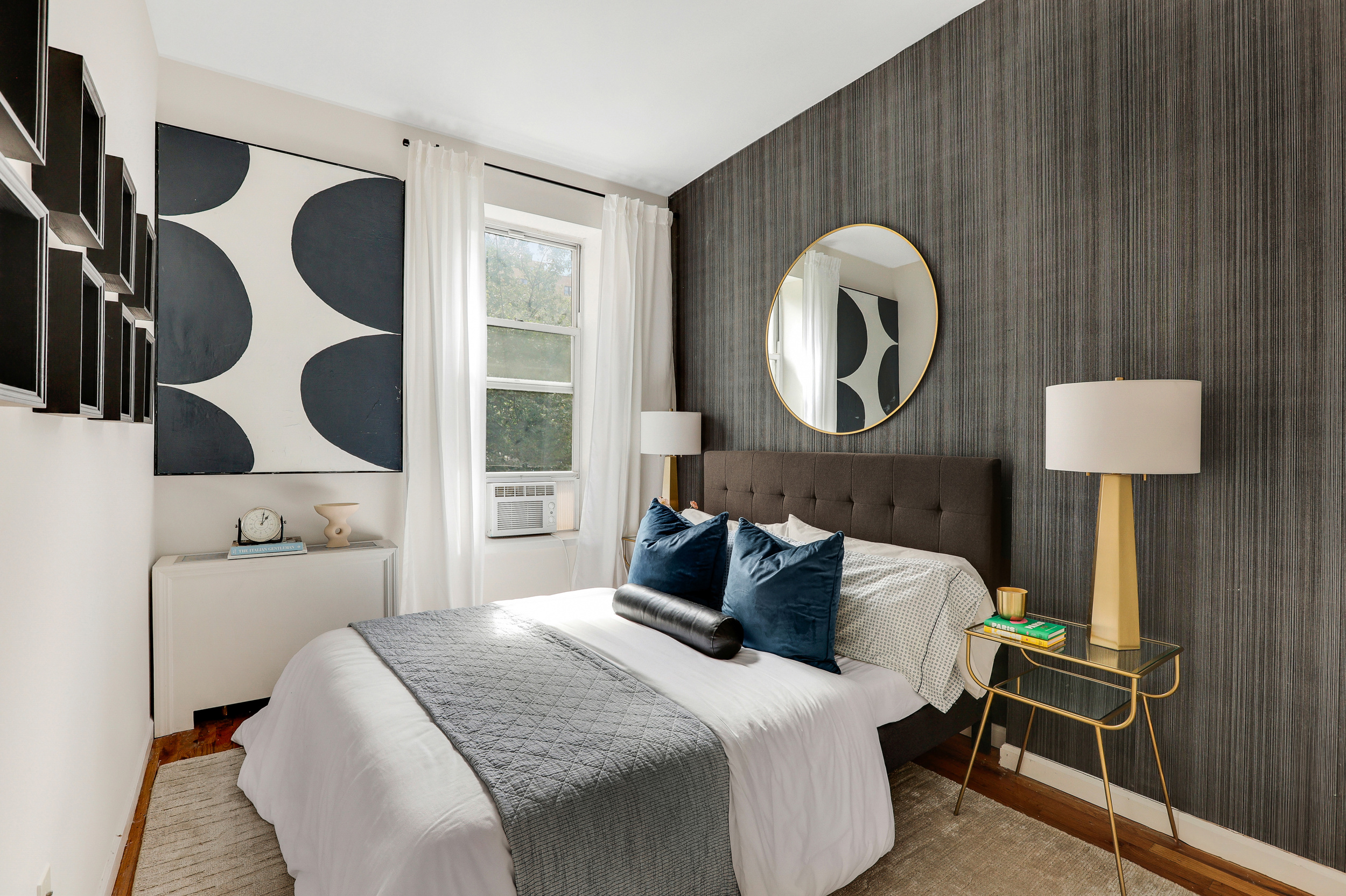 304 West 88th Street, Unit 4B Manhattan, NY 10024 - Photo 6 of 8 a bedroom with a bed and lamp