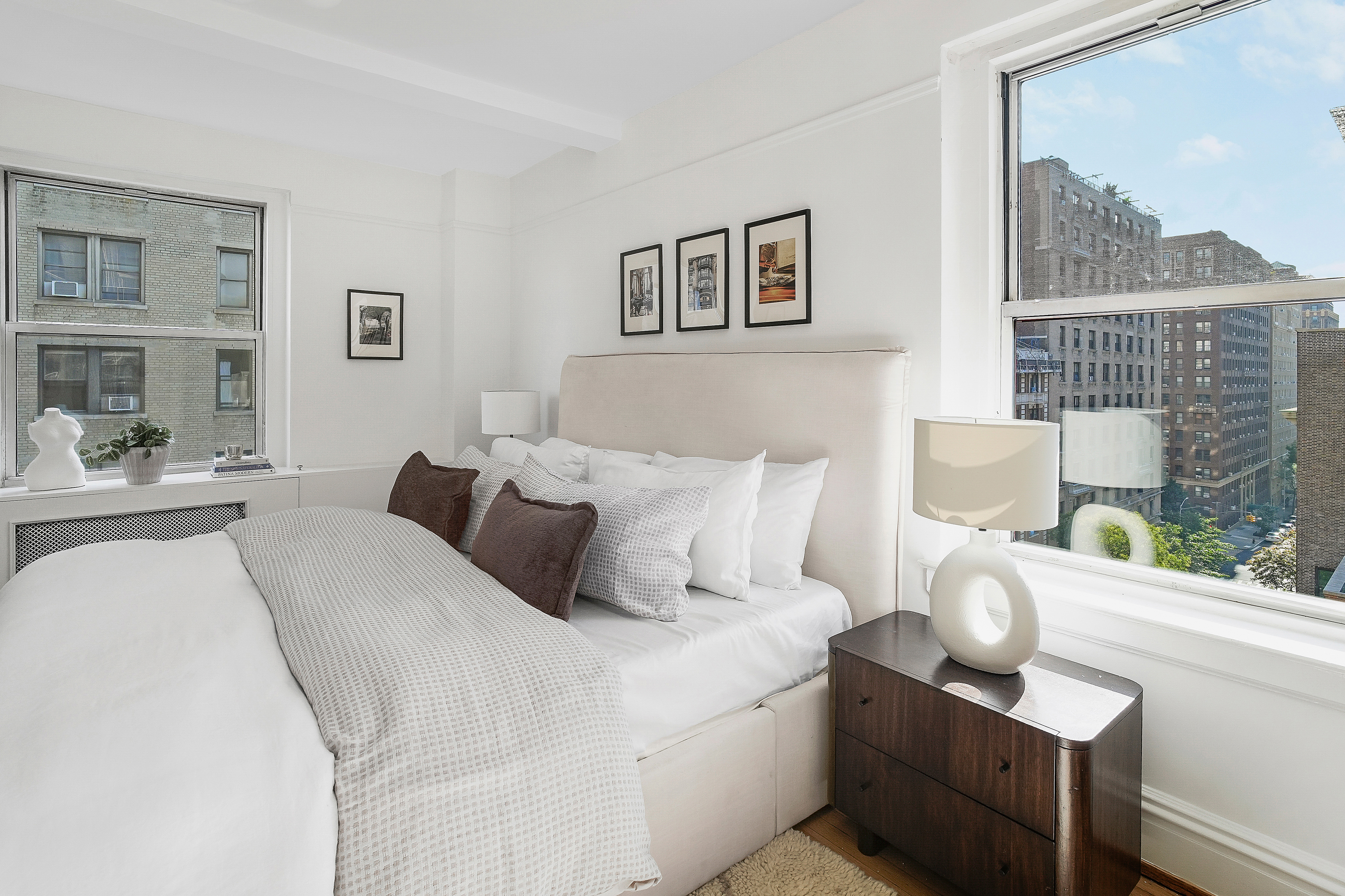 315 Riverside Drive, Unit 11B Manhattan, NY 10025 - Photo 9 of 19 a bedroom with bed and a painting on the wall