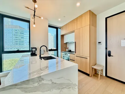 a kitchen with kitchen island a counter top space appliances and a counter space