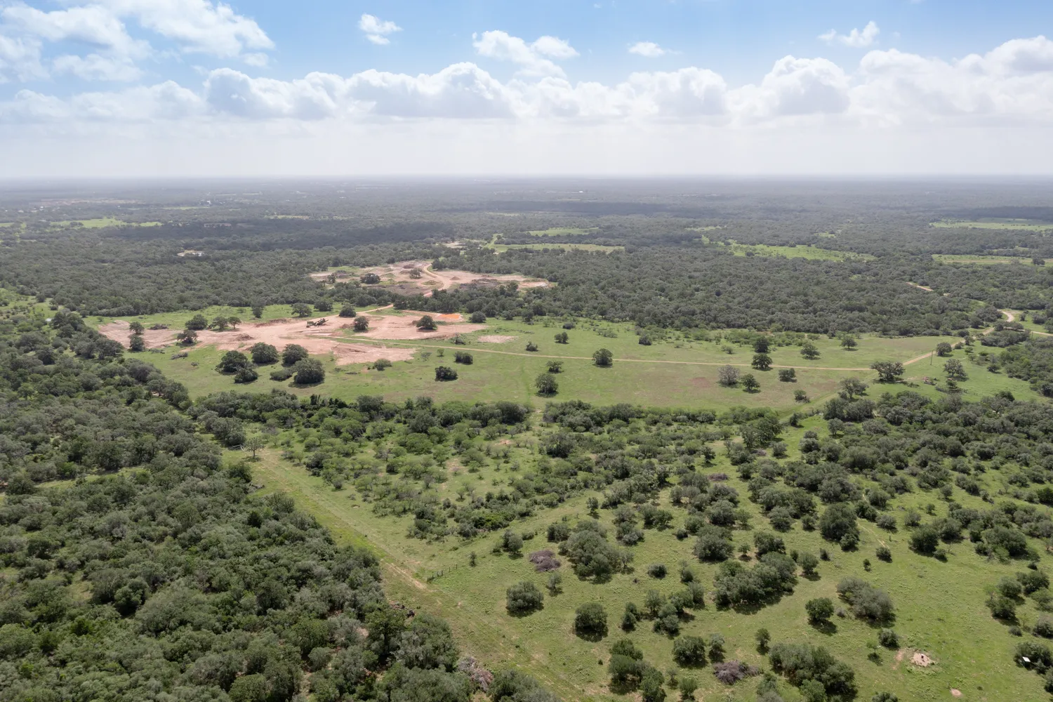 an aerial view of a houses with outdoor space