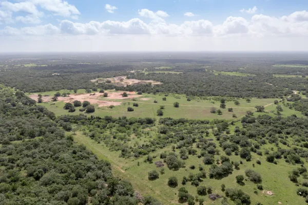 an aerial view of a houses with outdoor space