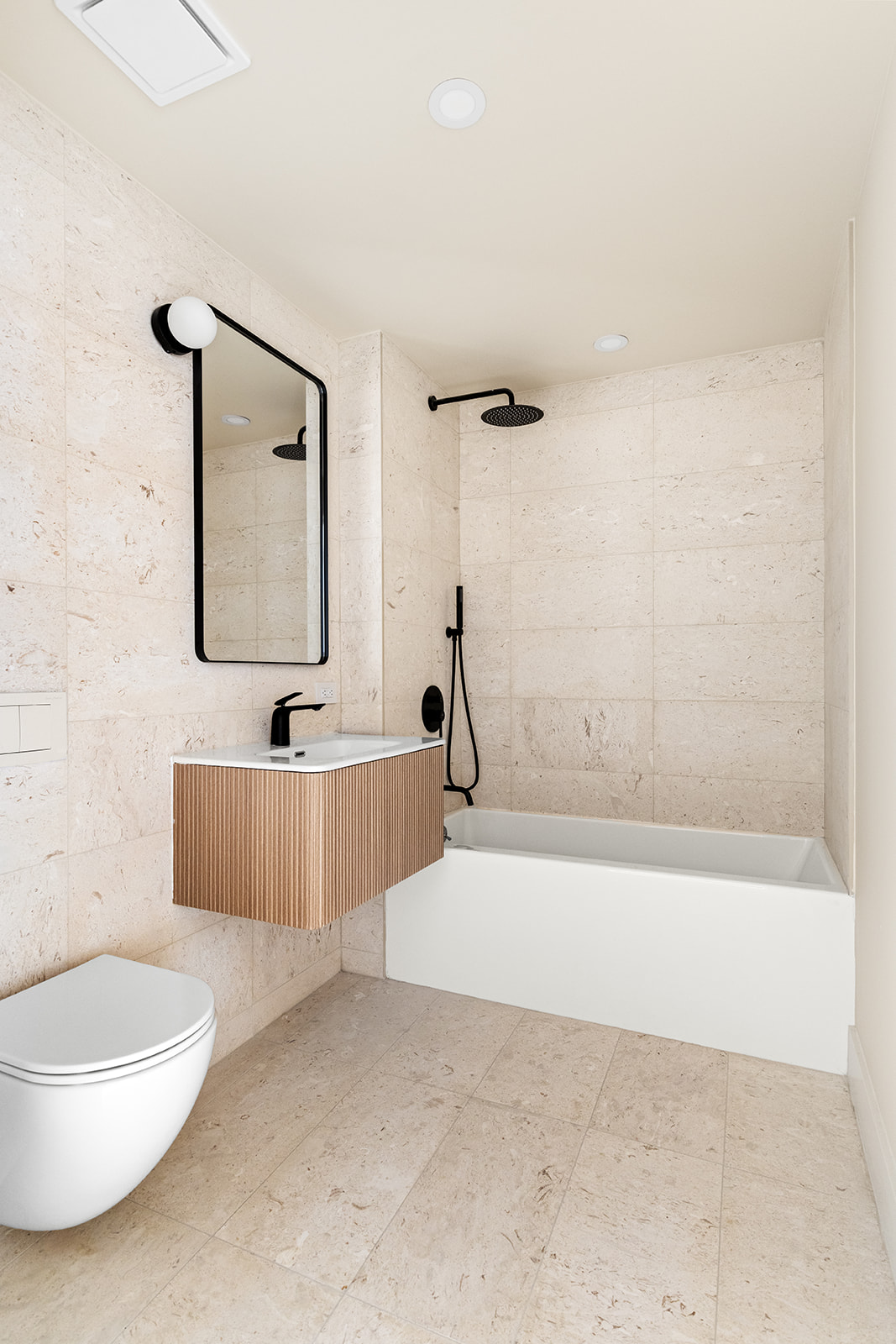 78 1st Place, Unit 5 Brooklyn, NY 11231 - Photo 15 of 24 a bathroom with a bathtub a toilet a sink and mirror
