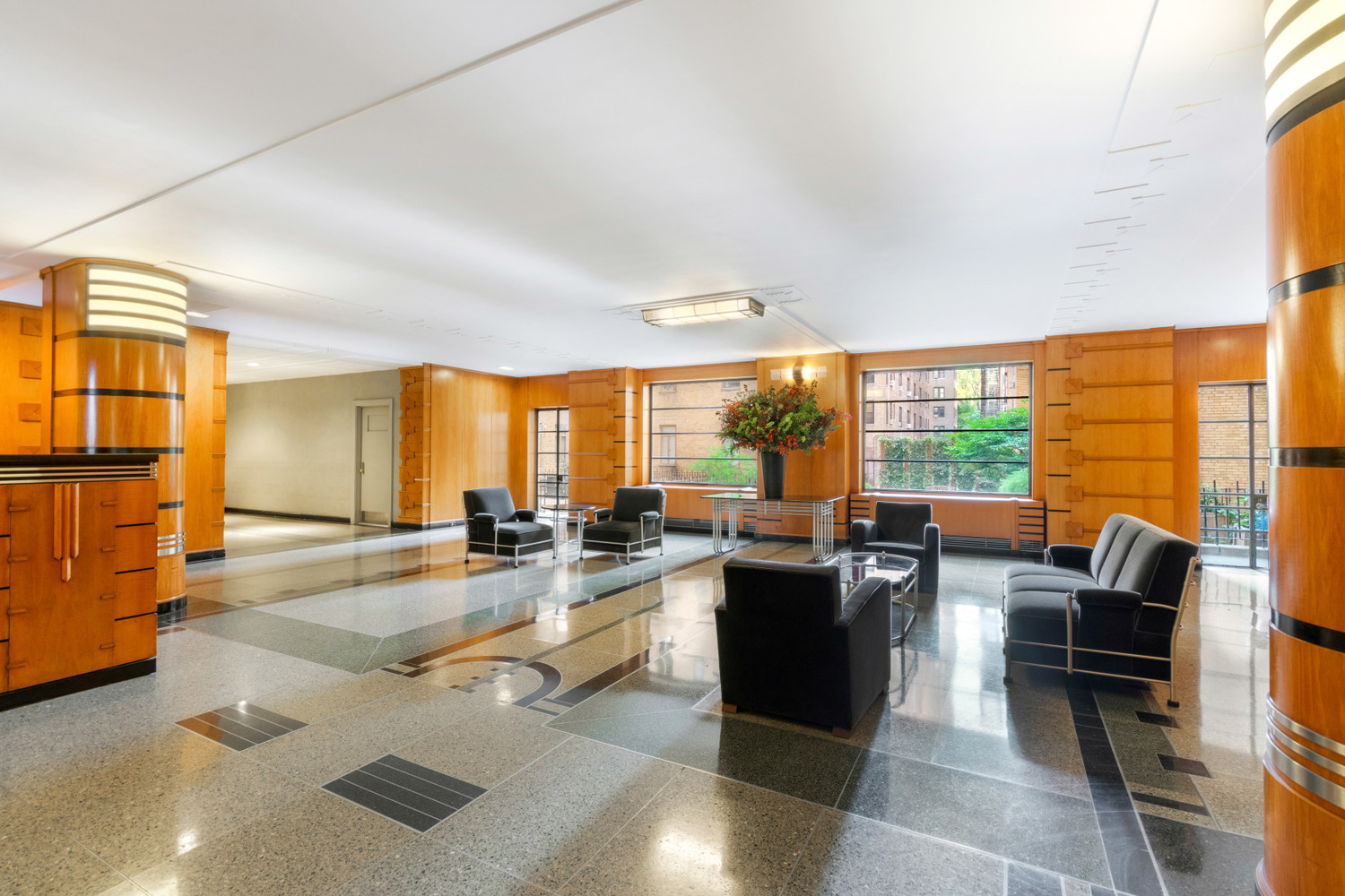 115 Central Park West, Unit 16H Manhattan, NY 10023 - Photo 25 of 30 a very nice looking living room with a large window and kitchen view