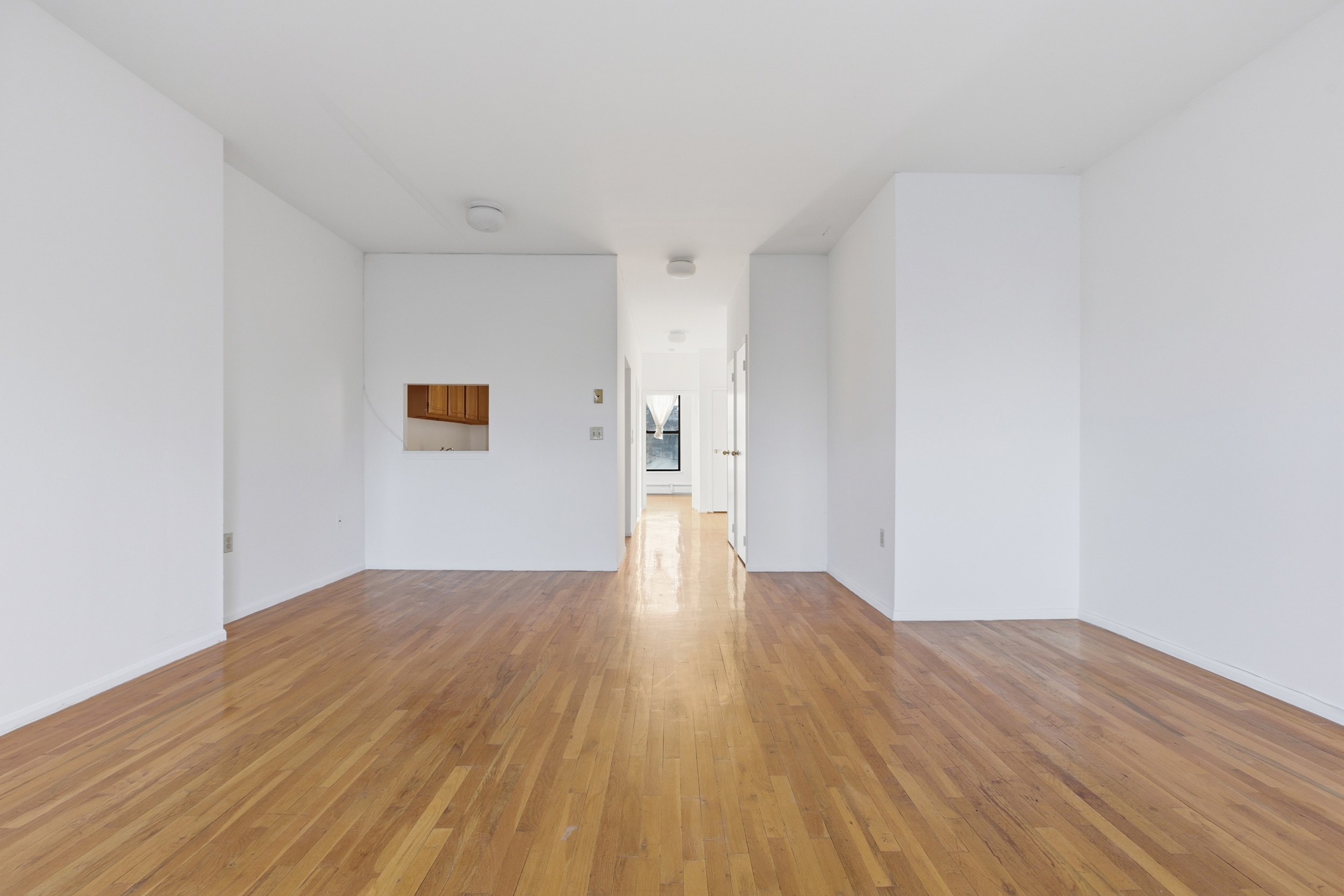 20 East 126th Street Manhattan, NY 10035 - Photo 14 of 19 a view of empty room with wooden floor