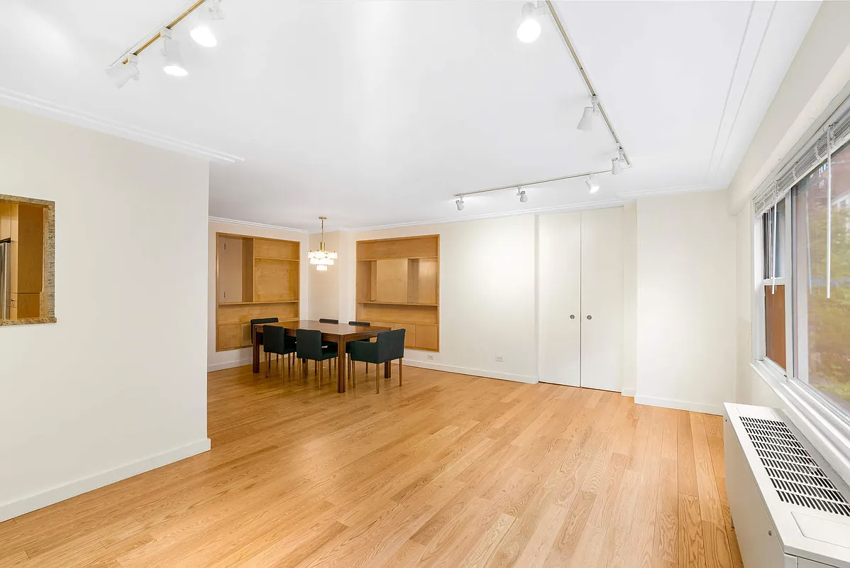 333 East 66th Street, Unit 2FE Manhattan, NY 10065 - Photo 4 of 19 a view of dining room with furniture and window