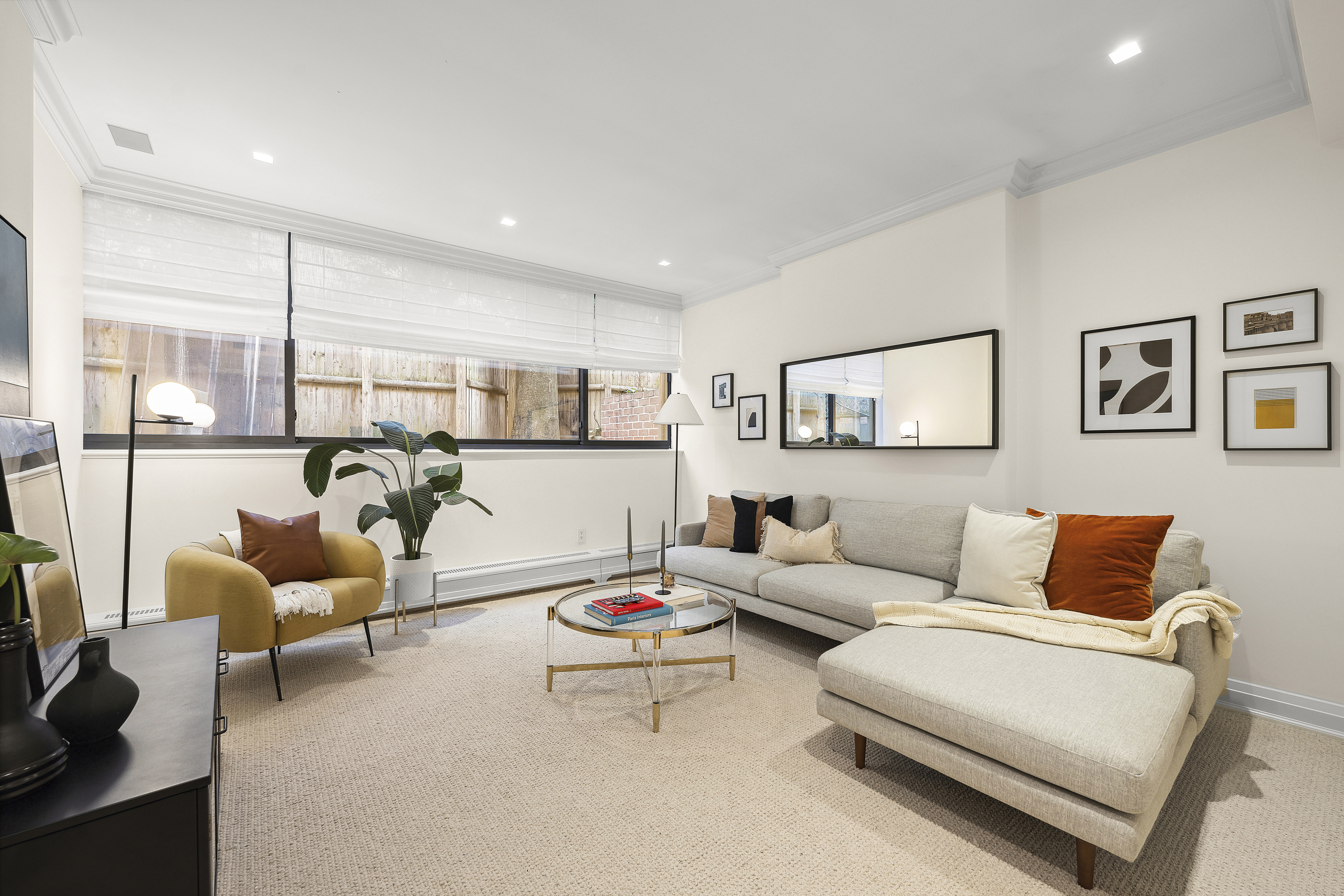 50 East 73rd Street Manhattan, NY 10021 - Photo 13 of 32 a living room with furniture and a large window
