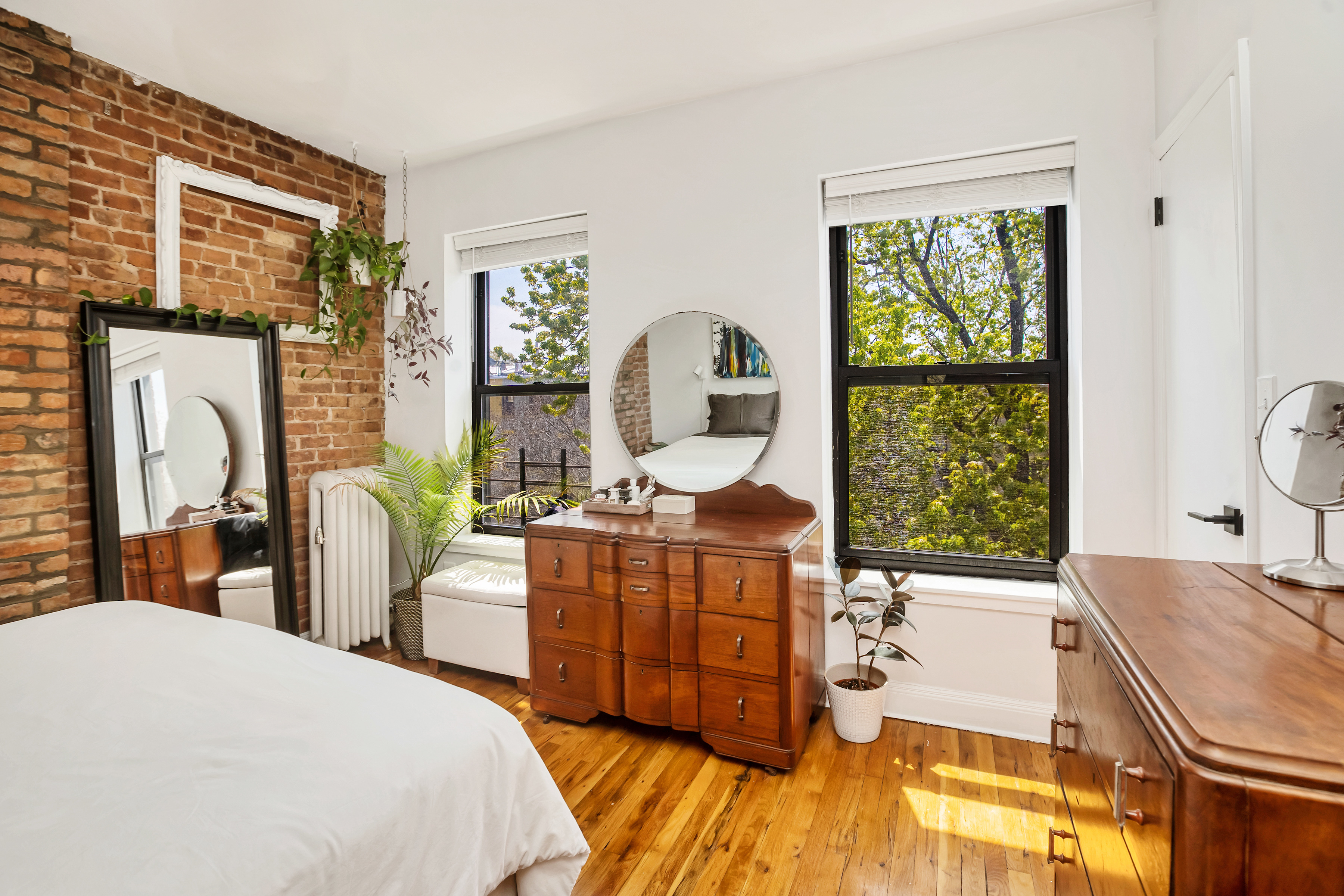44 Sterling Place, Unit 2 Brooklyn, NY 11217 - Photo 5 of 9 a bedroom with a bed a dresser next to a window