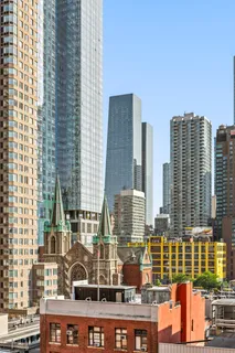 a view of ocean with tall buildings