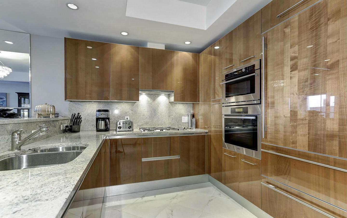 1881 North Nash Street, Unit 1009 Arlington, VA 22209 - Photo 2 of 36 a kitchen with stainless steel appliances granite countertop a sink stove and refrigerator