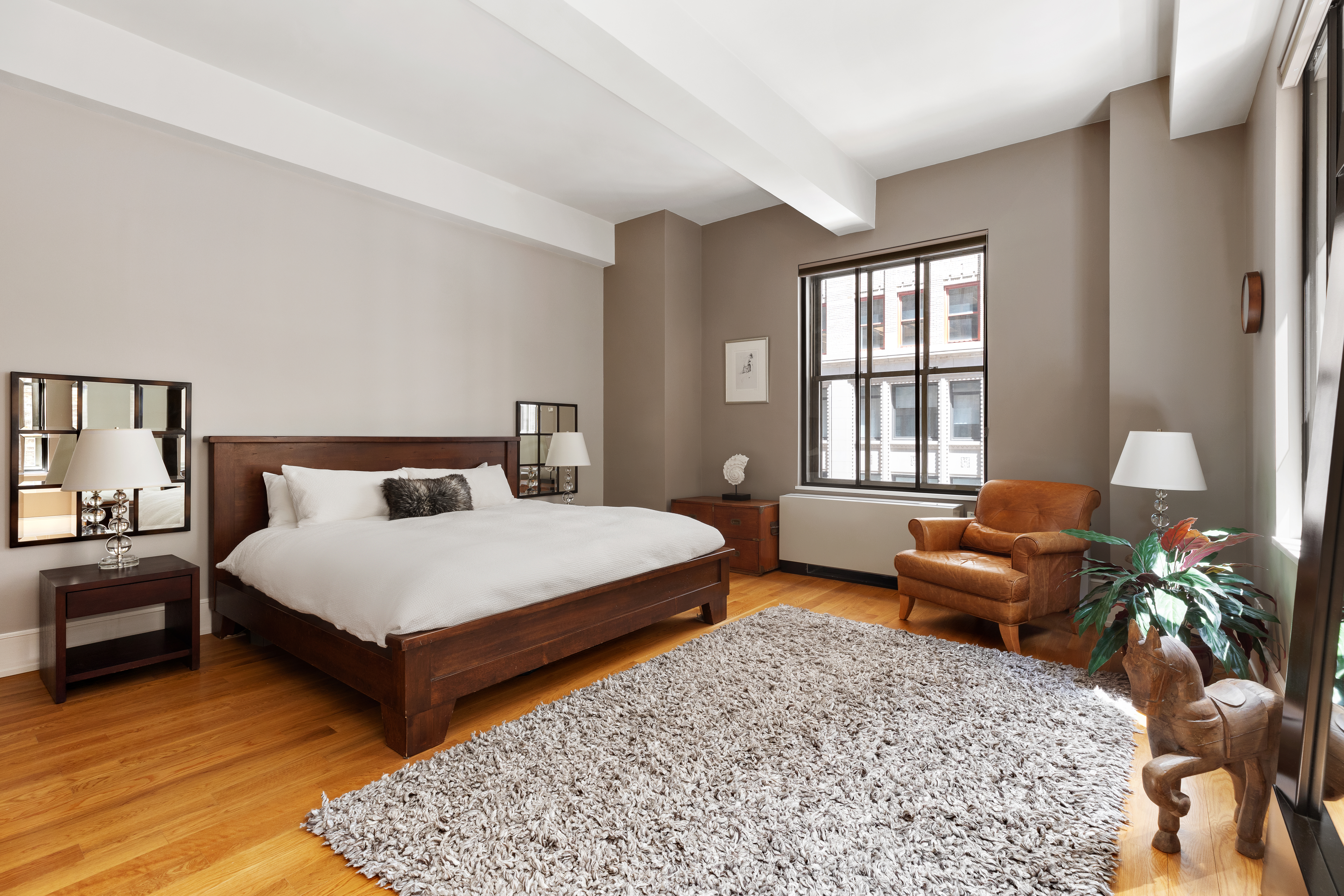 130 West 30th Street, Unit 3B Manhattan, NY 10001 - Photo 9 of 15 a bedroom with bed and a couch