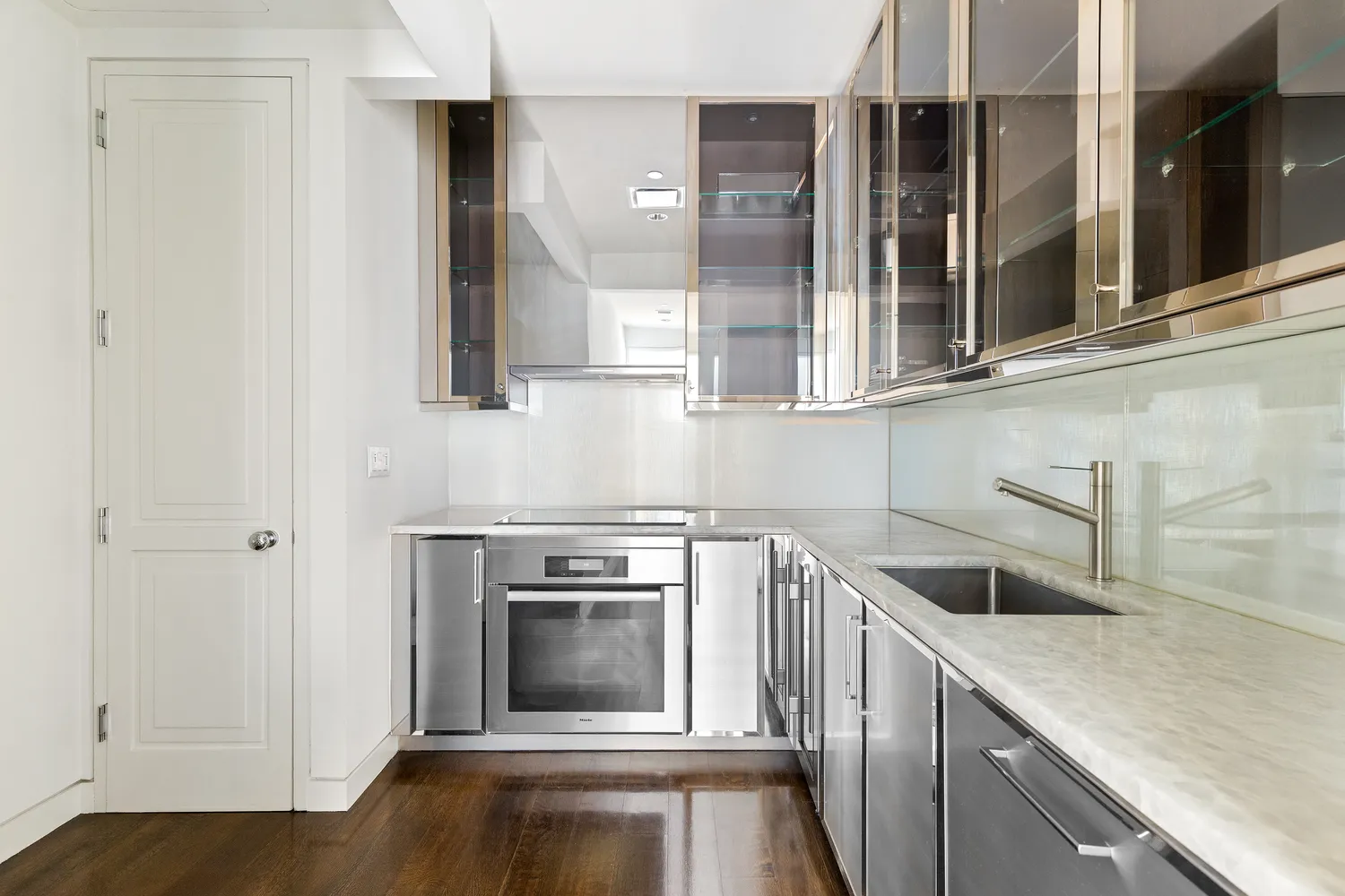 a kitchen with a stove microwave and a sink