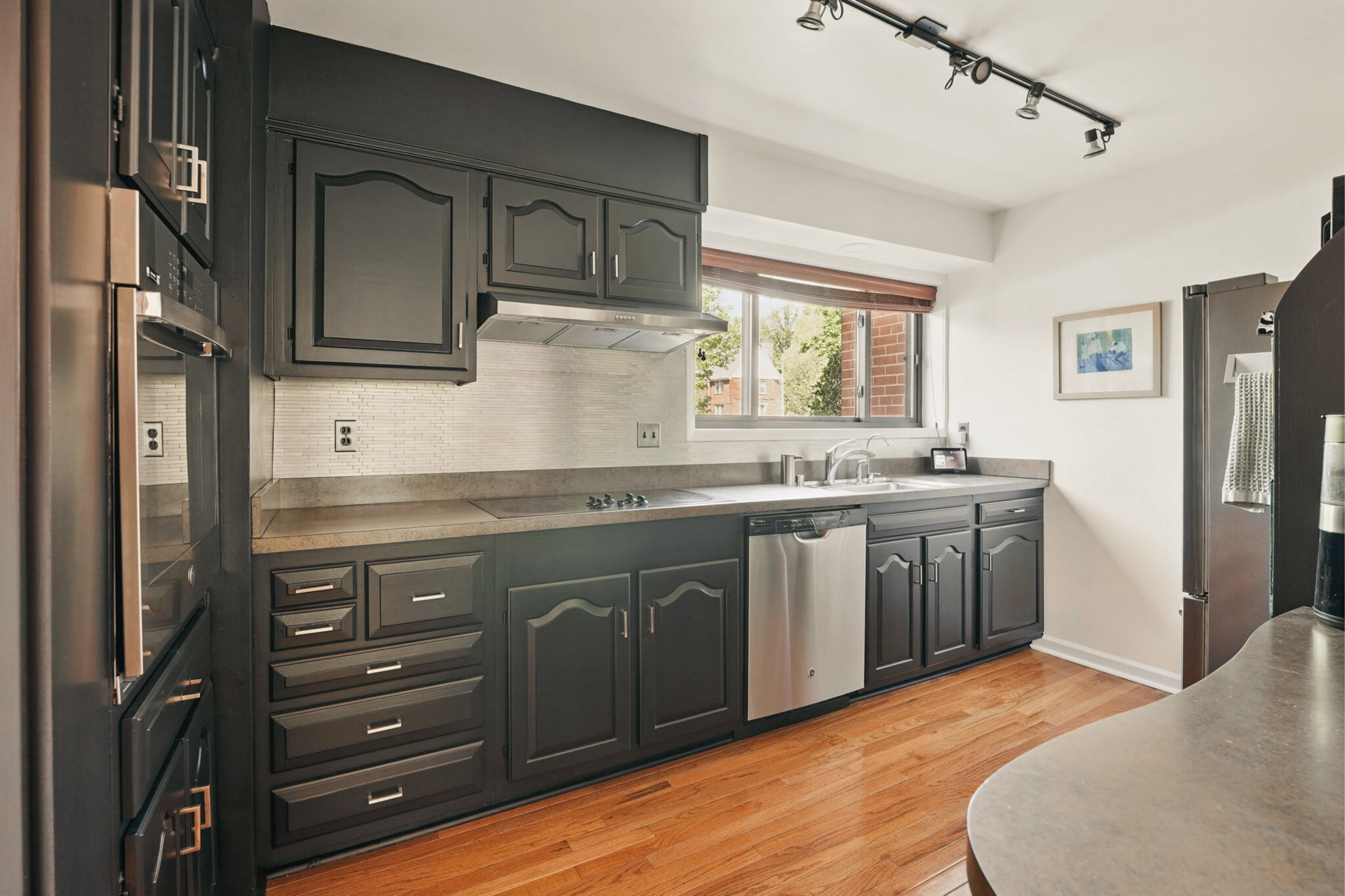 8003 16th Street Northwest Washington, DC 20012 - Photo 15 of 38 a kitchen with a sink stove and refrigerator