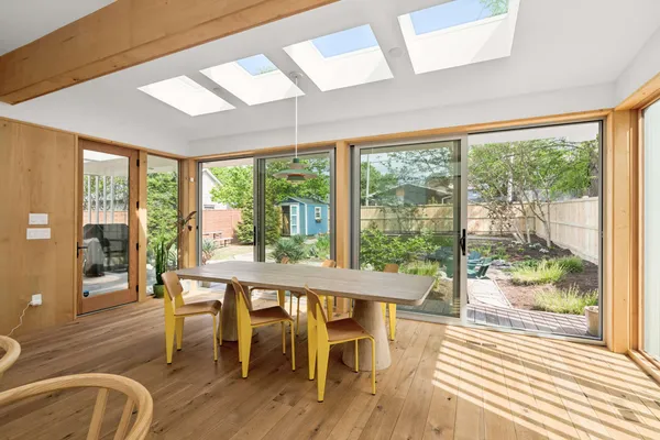 a view of a dining room with furniture and wooden floor