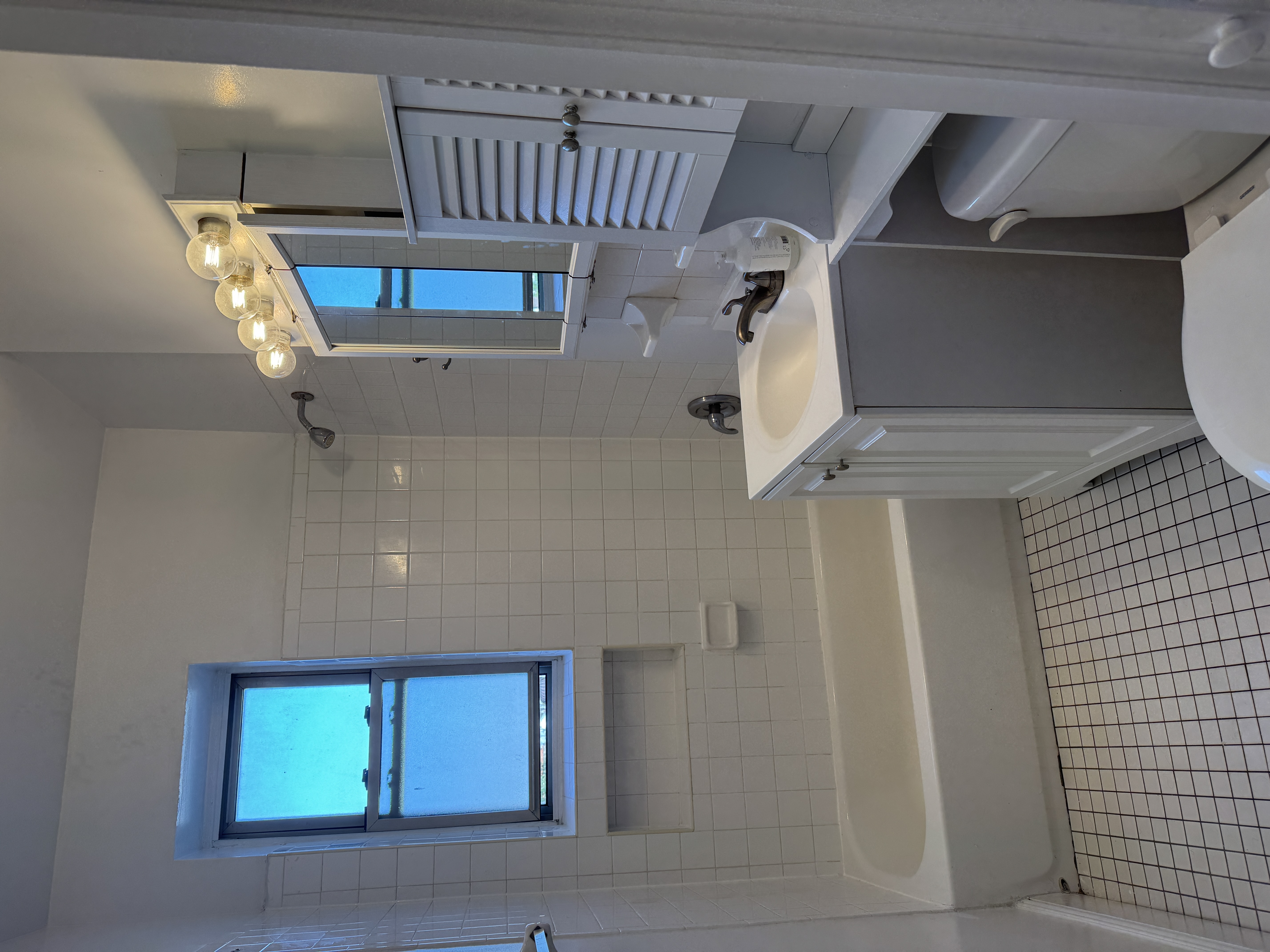 260 Cumberland Street, Unit 21 Brooklyn, NY 11205 - Photo 12 of 13 a bathroom with a sink a toilet and shower