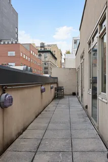 a bathroom with a granite countertop sink a toilet and a bathtub