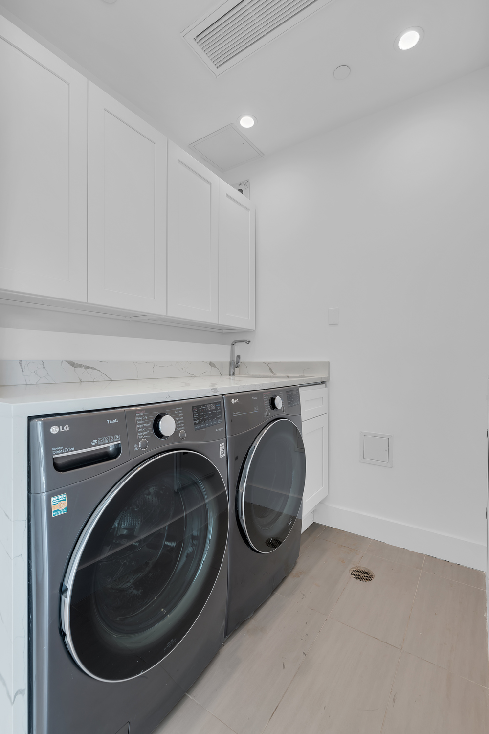 38-26 29th Street, Unit 2 Queens, NY 11101 - Photo 13 of 14 a utility room with dryer and washer