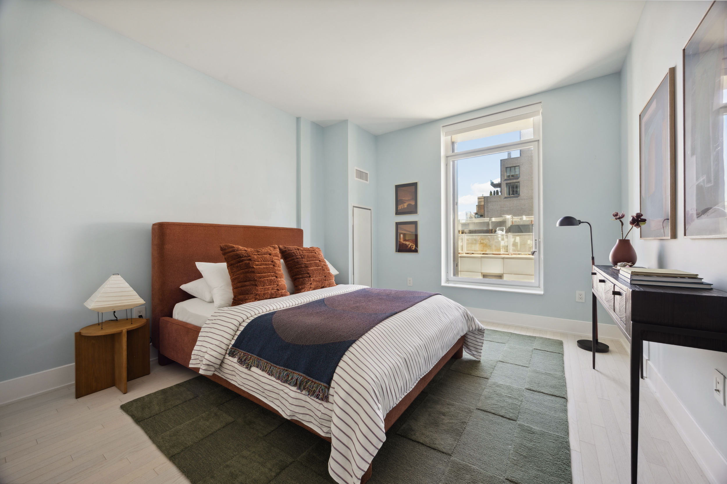 91 Leonard Street, Unit 11G Manhattan, NY 10013 - Photo 8 of 16 a spacious bedroom with a bed and window