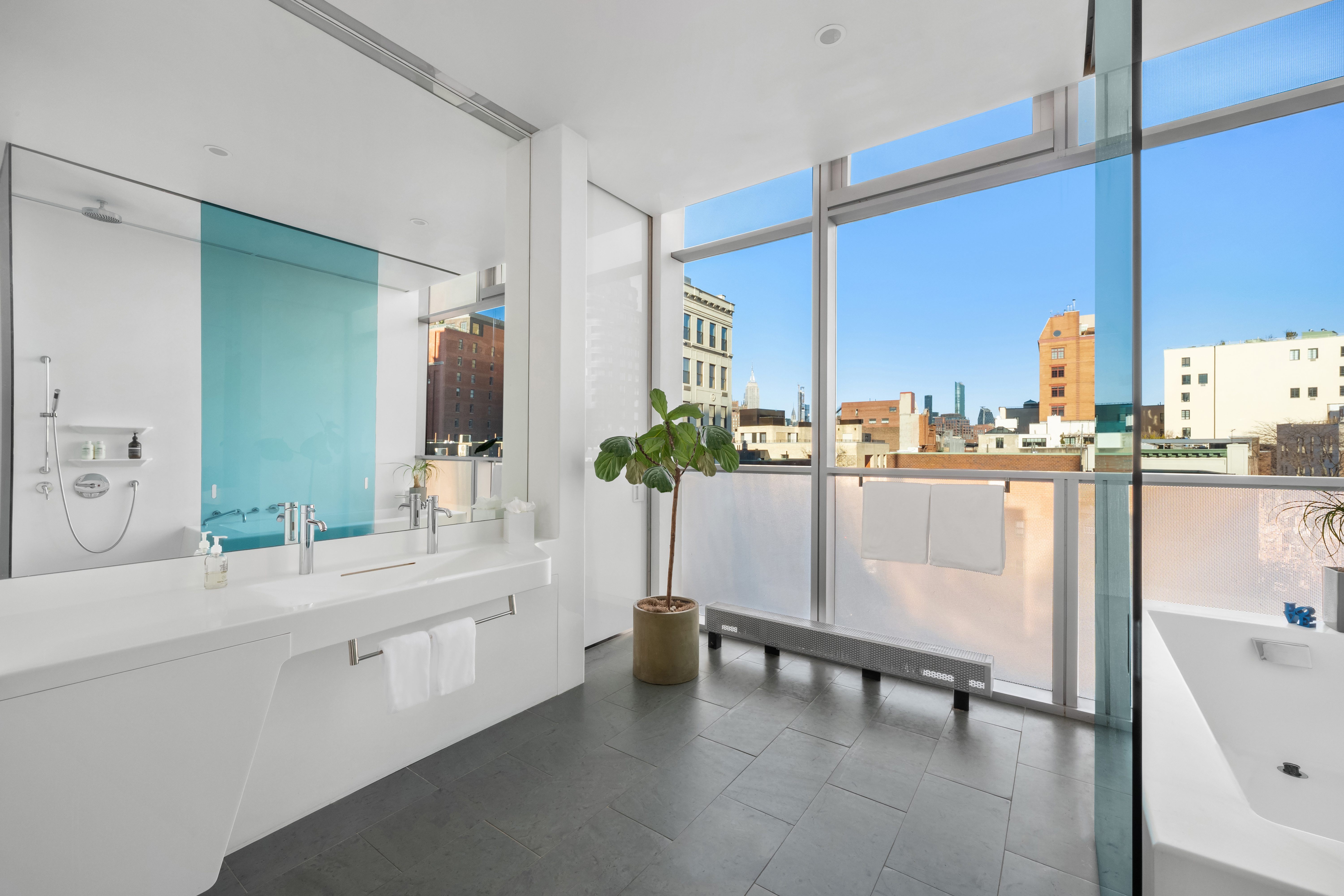 166 Perry Street, Unit 6A Manhattan, NY 10014 - Photo 9 of 20 a room with a sink table and chairs