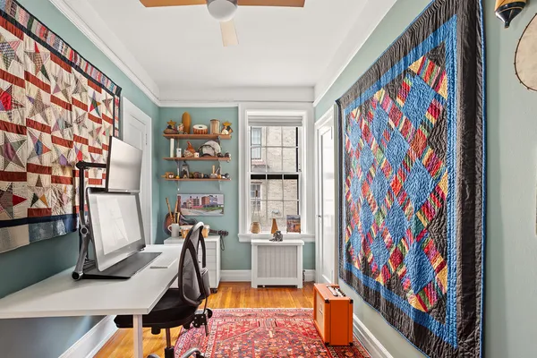 a view of a workspace with furniture and toys
