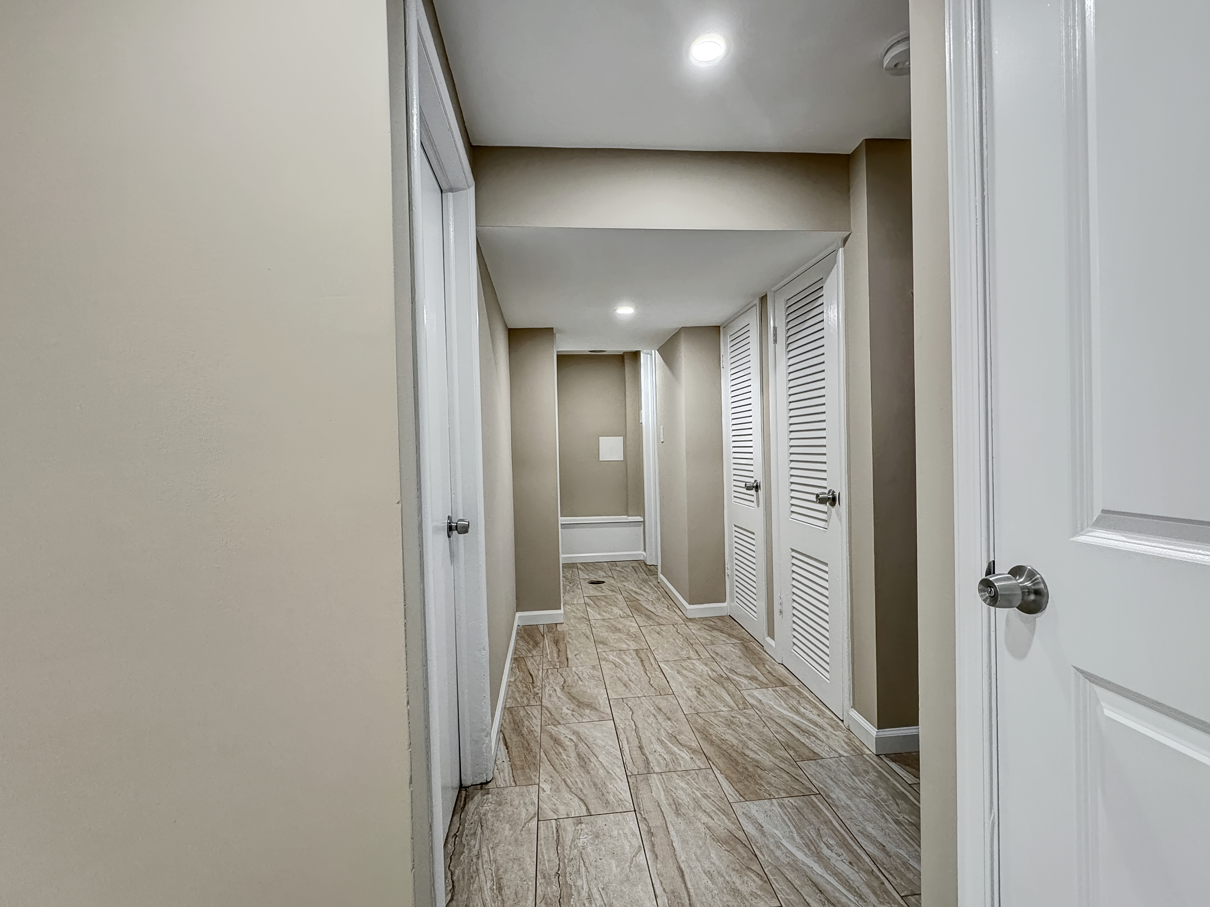 2408 Lillian Drive Silver Spring, MD 20902 - Photo 22 of 40 a view of a hallway with a livingroom and a bathroom