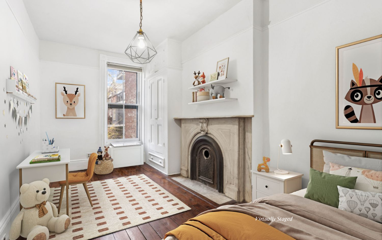 509 6th Avenue Brooklyn, NY 11215 - Photo 14 of 20 a bedroom with furniture and a fireplace