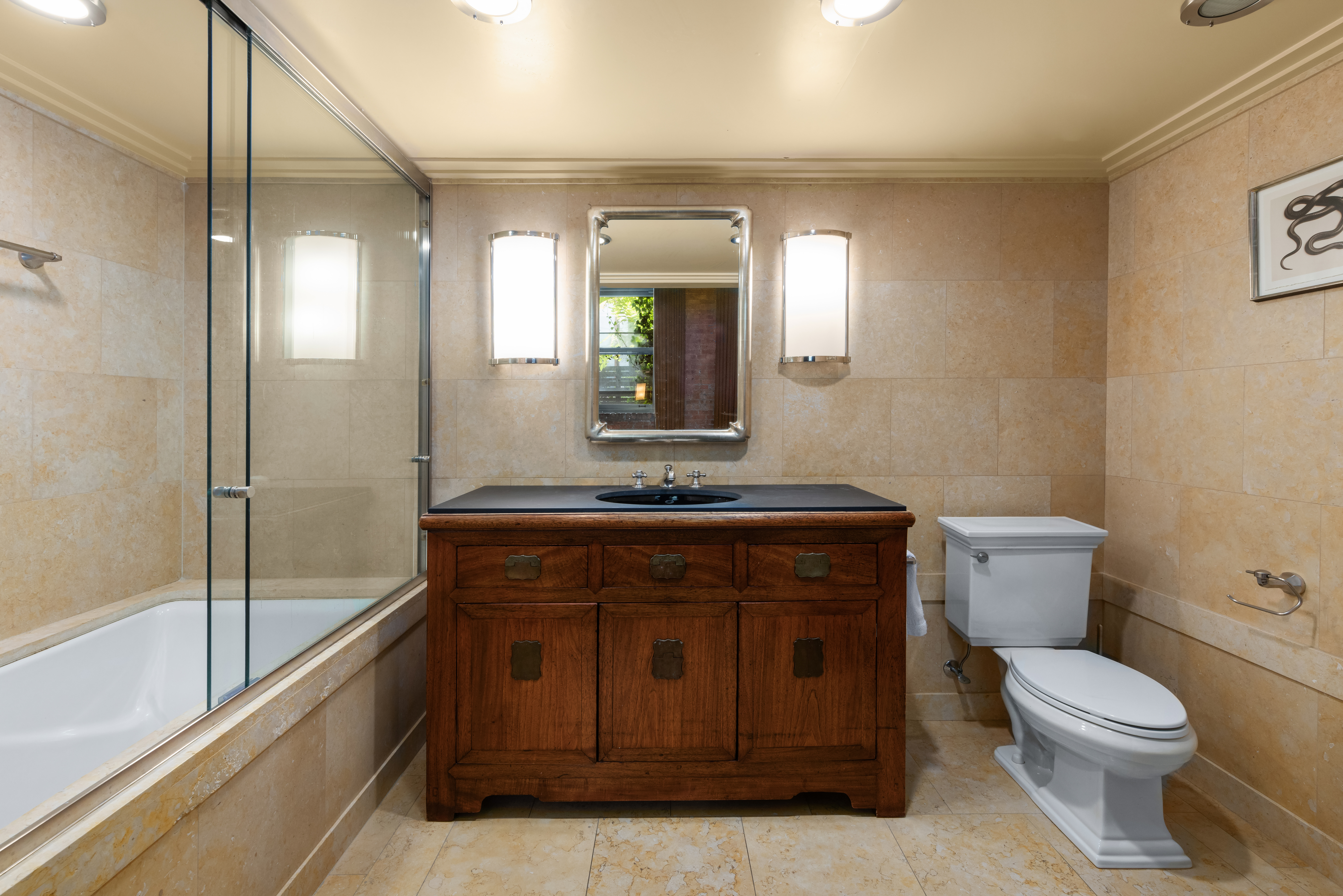 72 Horatio Street, Unit 1S Manhattan, NY 10014 - Photo 9 of 15 a bathroom with a toilet a sink and mirror