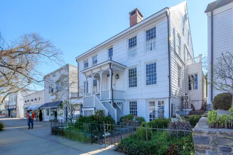 a front view of a building with garden