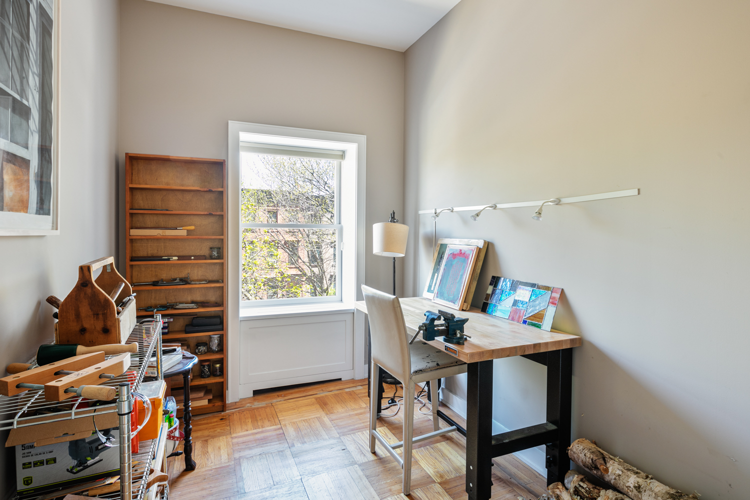 380 3rd Street, Unit PARLOR Brooklyn, NY 11215 - Photo 15 of 19 a view of a workspace with furniture and a window