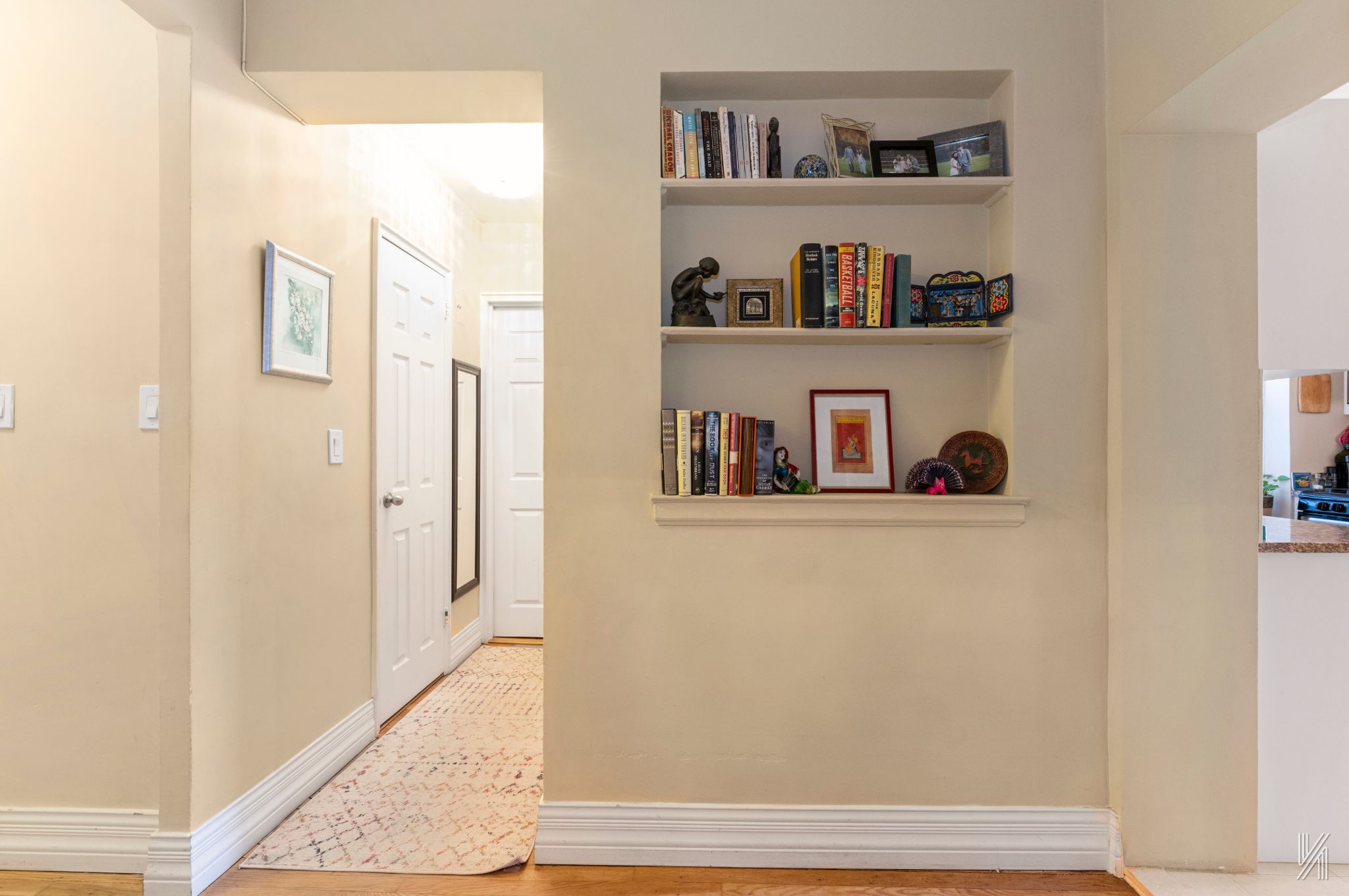 34-41 85th Street, Unit 4P Queens, NY 11372 - Photo 11 of 20 a cabinet with painting on the wall