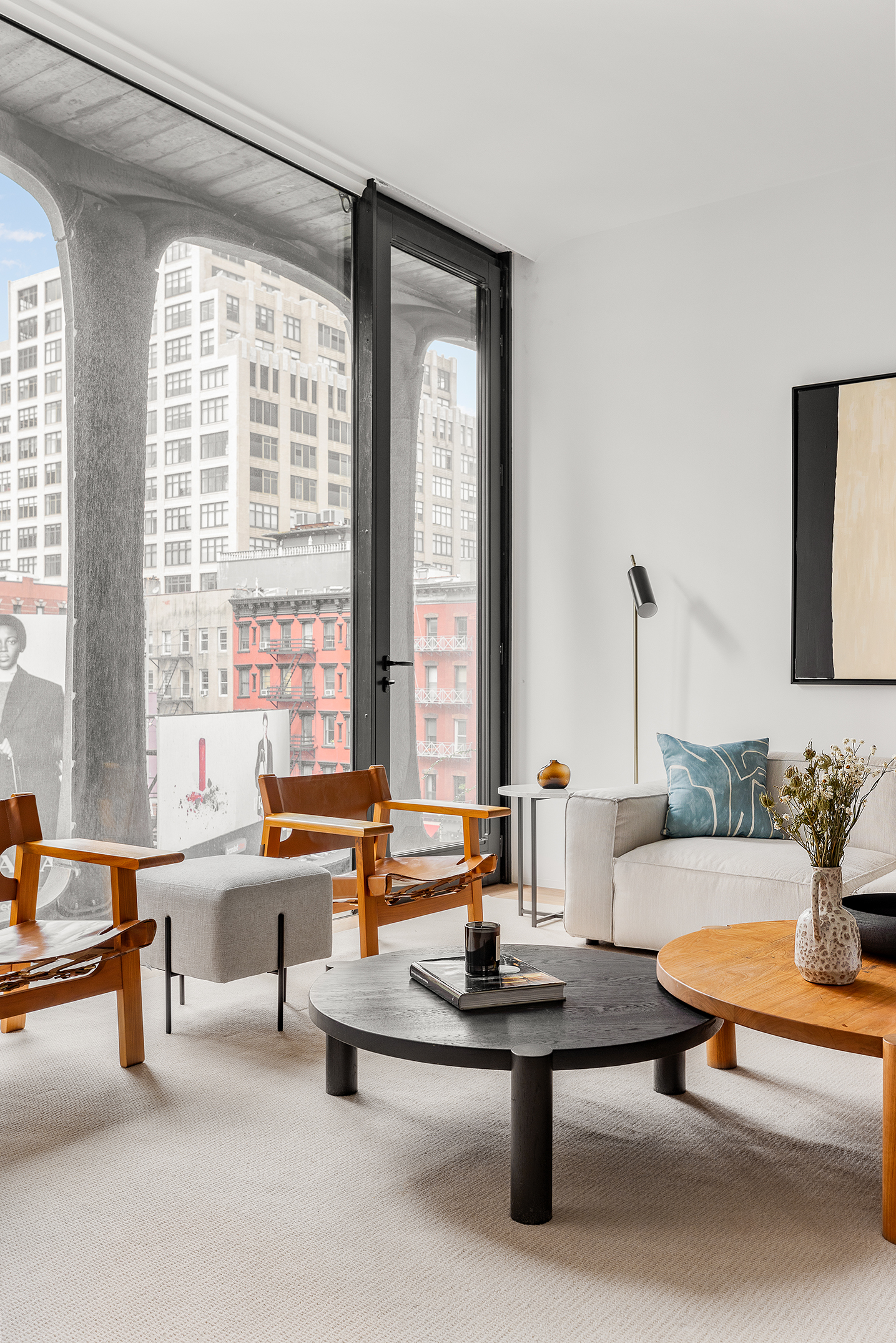 325 West Broadway, Unit 4B Manhattan, NY 10013 - Photo 2 of 17 a living room with furniture and large windows
