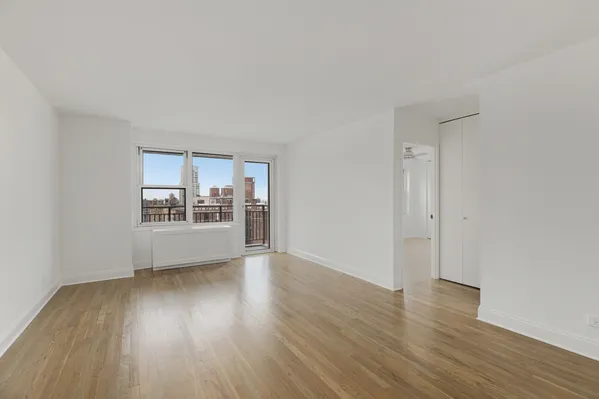 a view of wooden floor and a living room