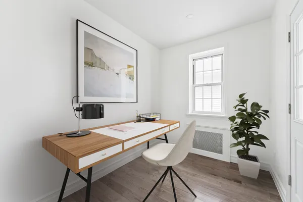a room with a table and a potted plant