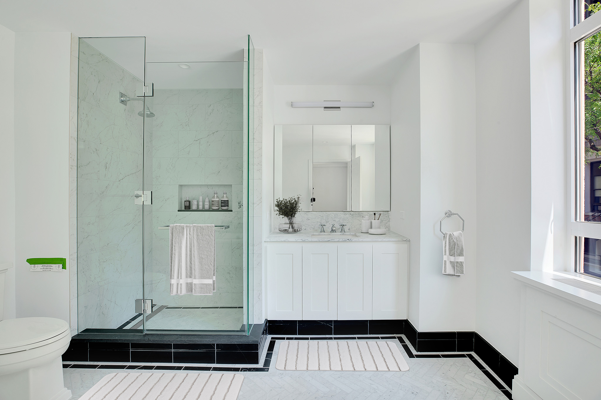 25 Central Park West, Unit 2Q Manhattan, NY 10023 - Photo 6 of 12 a bathroom with a sink and a mirror