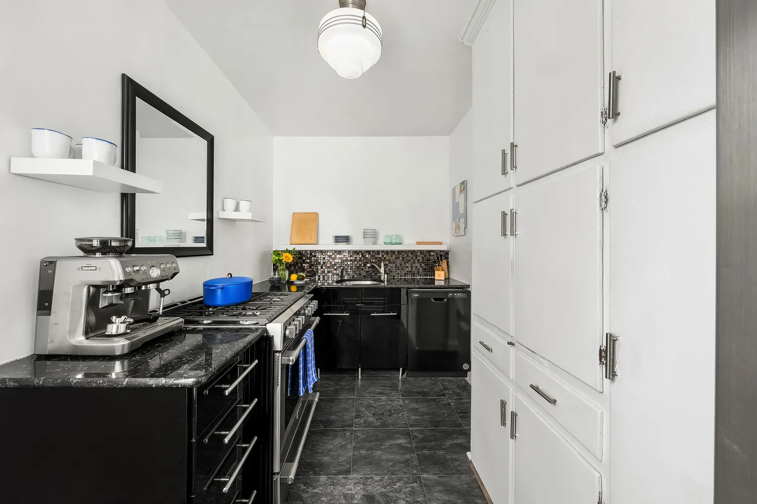 a kitchen with a stove top oven and cabinets