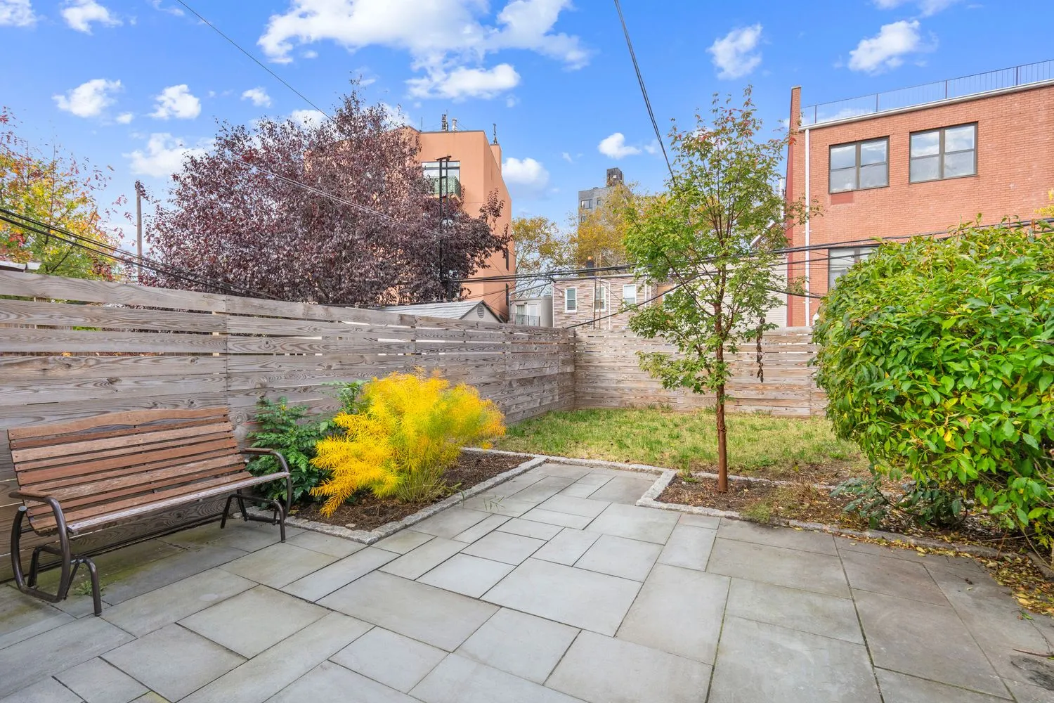a view of a backyard with sitting area