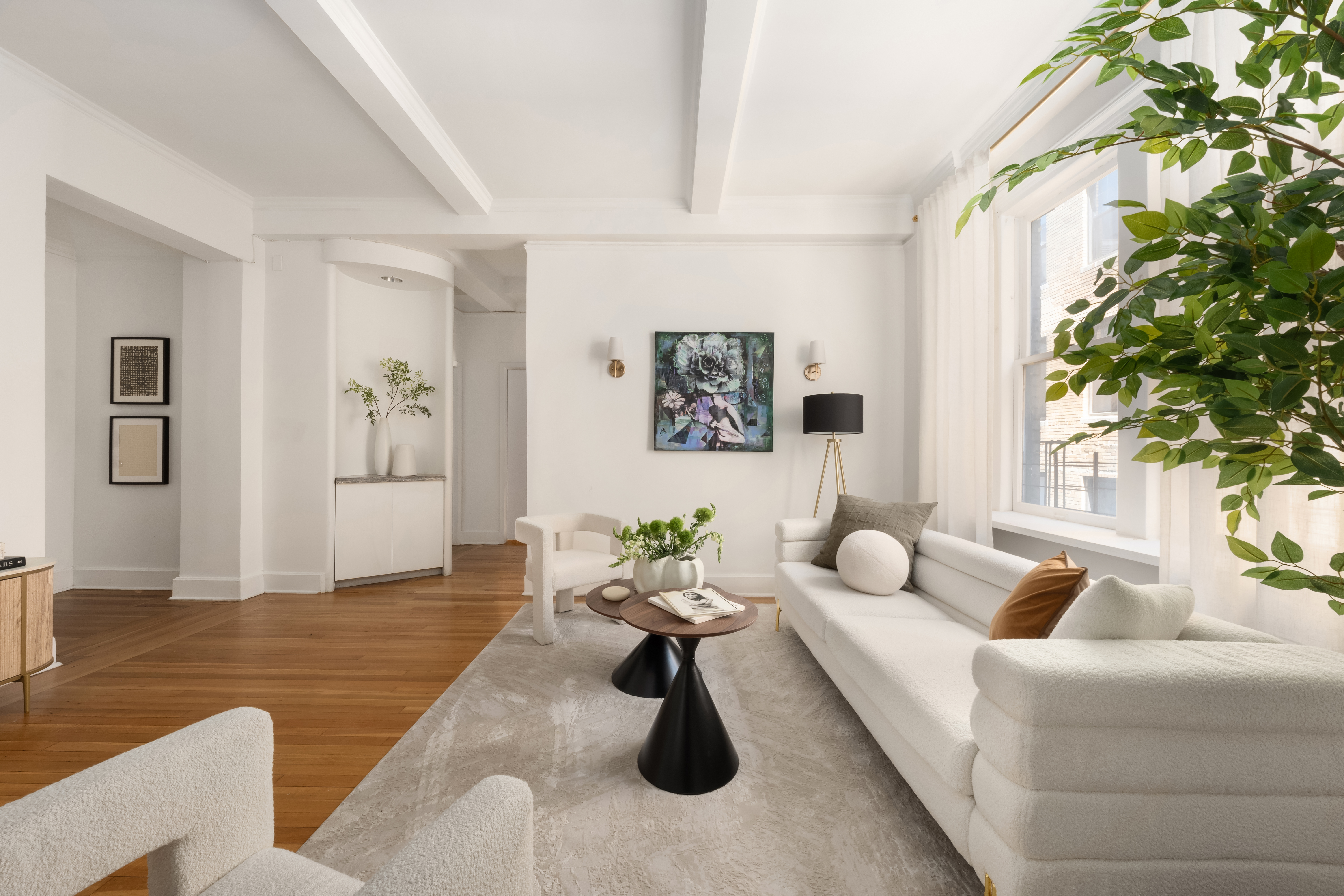 1060 Park Avenue, Unit 11A Manhattan, NY 10128 - Photo 2 of 12 a living room with furniture and a potted plant