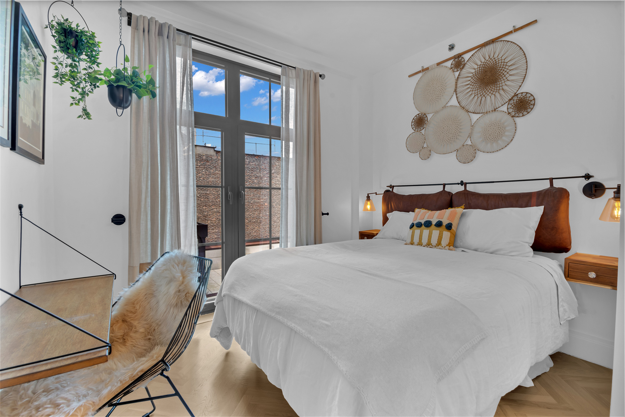 a bedroom with a bed and a painting on the wall